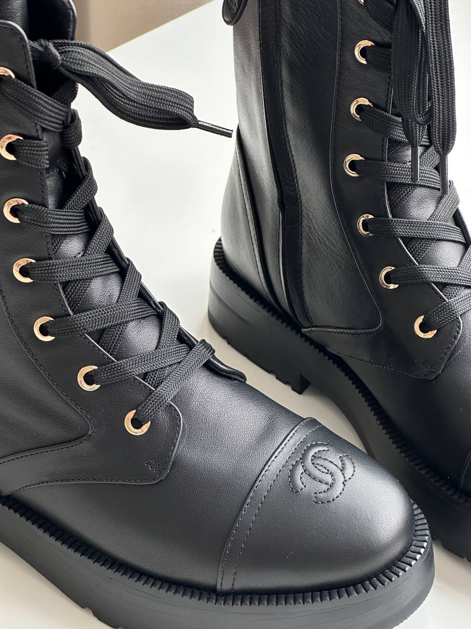 Chanel CC Embossed Leather Lace-Up Combat Boots