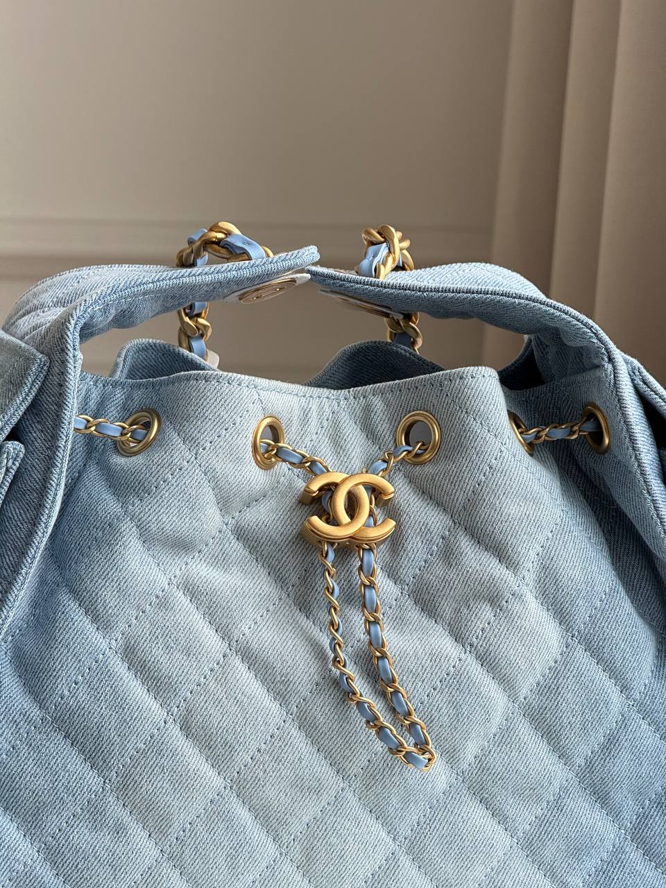 Chanel 25 Quilted Denim Drawstring Bucket Bag