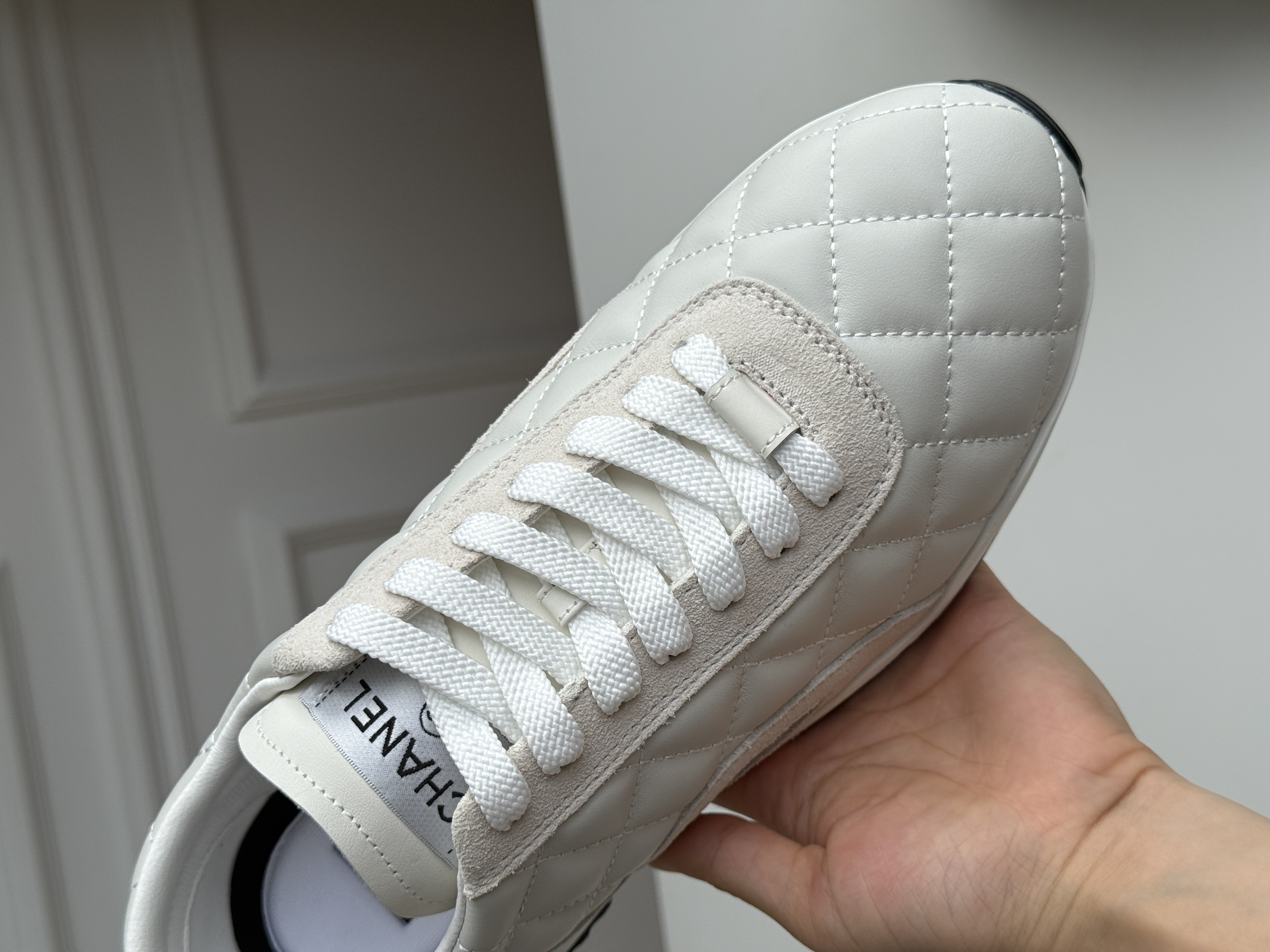 CHANEL Quilted Low-Top Sneakers