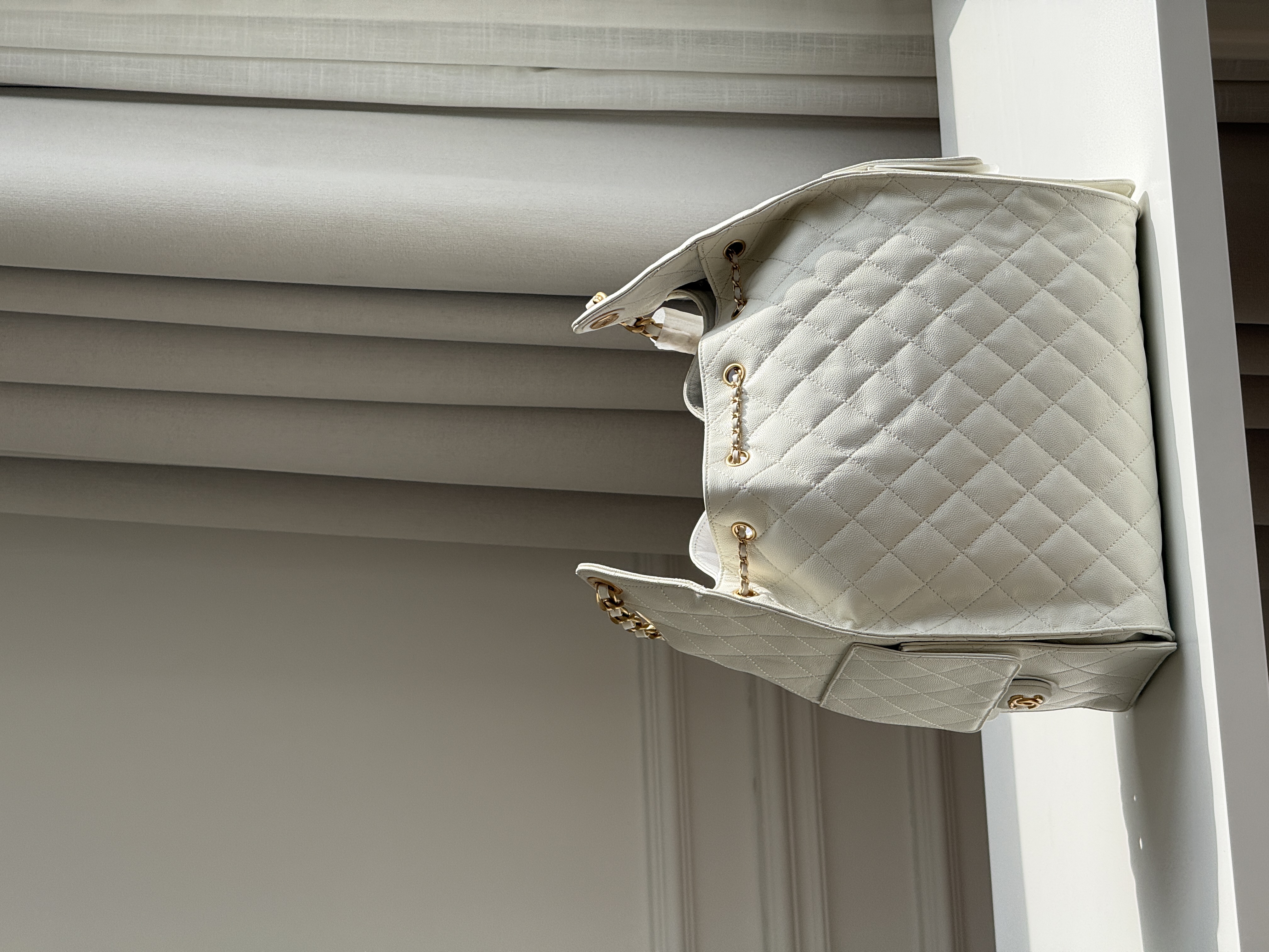 CHANEL Quilted Drawstring Bucket Bag in Milky White