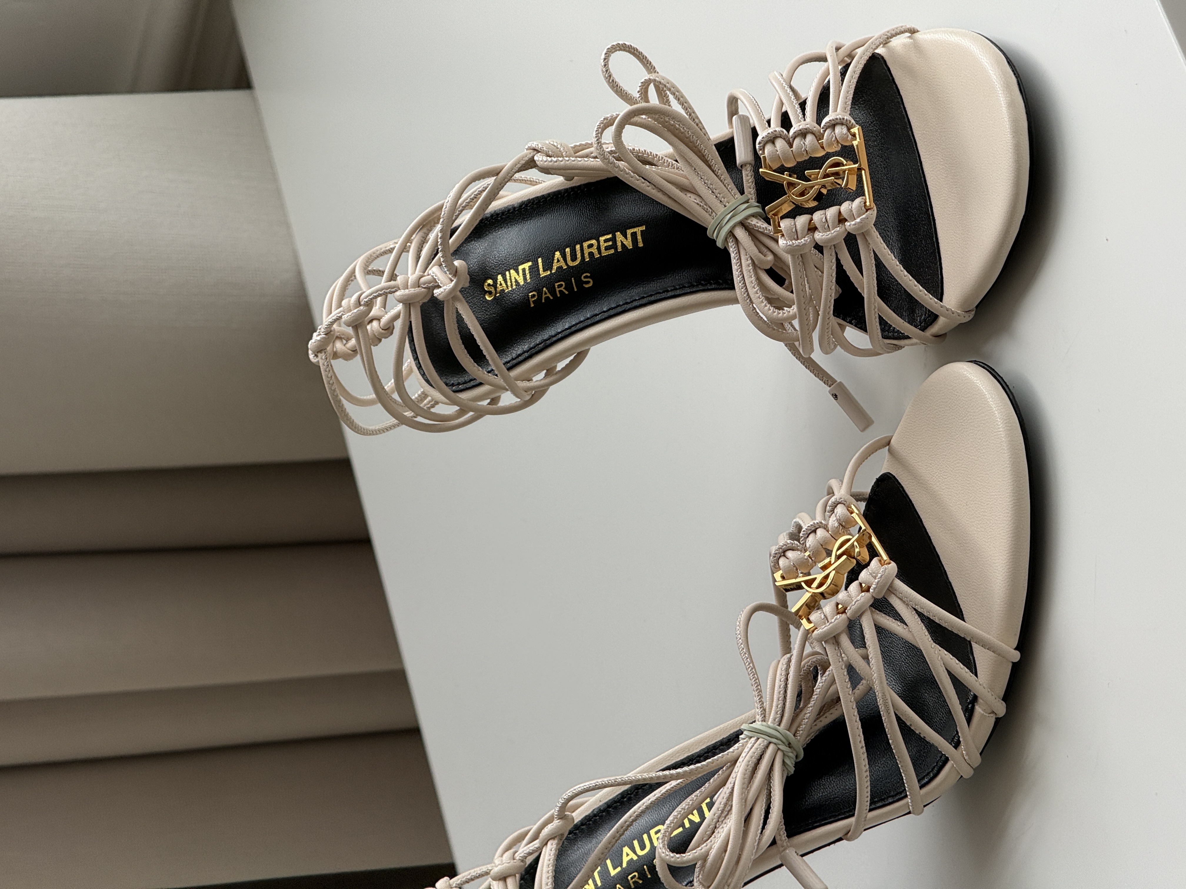 Saint Laurent Off-White Knotted Strappy Stiletto Heel Sandals with YSL Logo