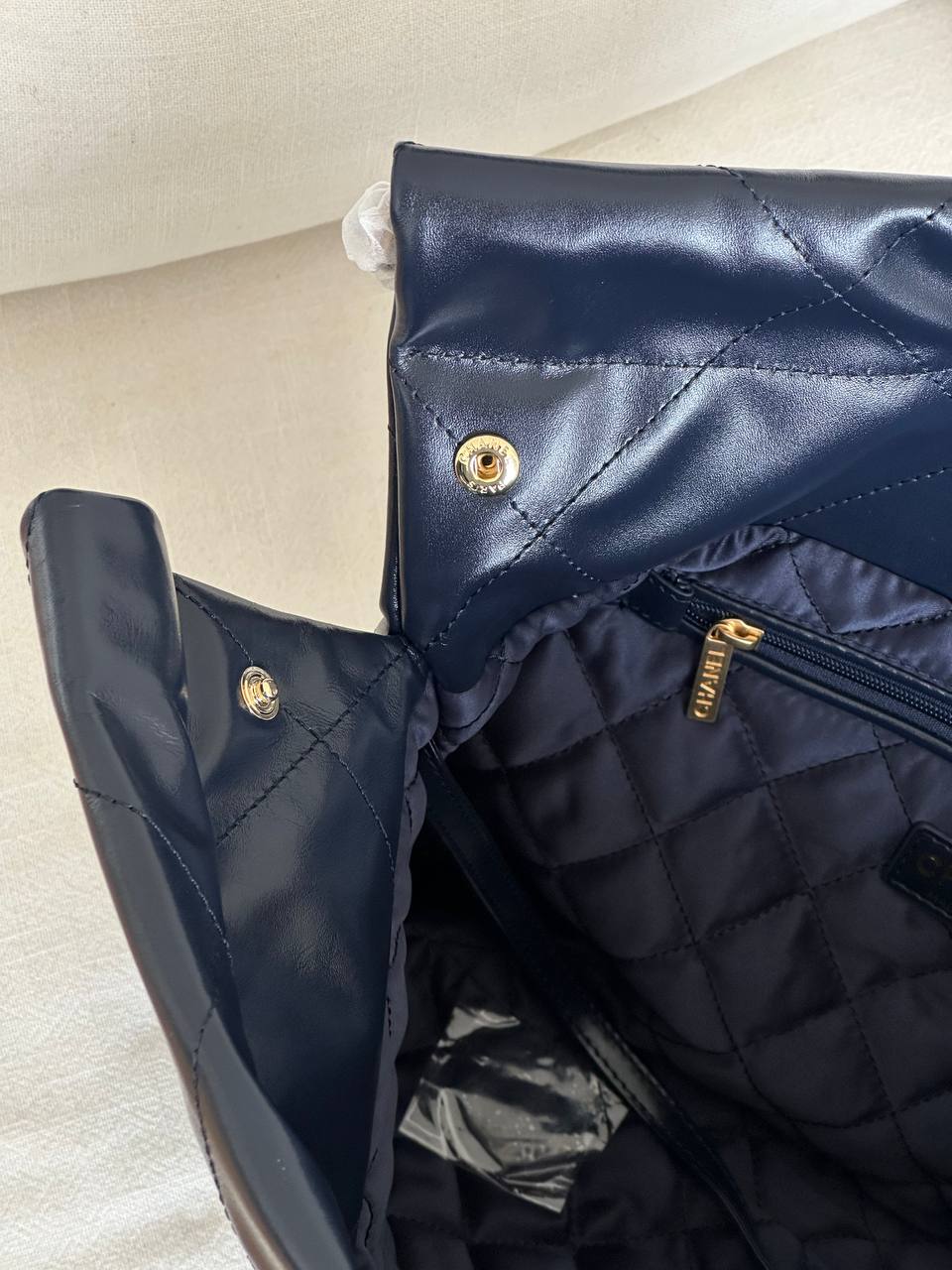 CHANEL 22 Quilted Shiny Calfskin Tote Bag in Navy Blue