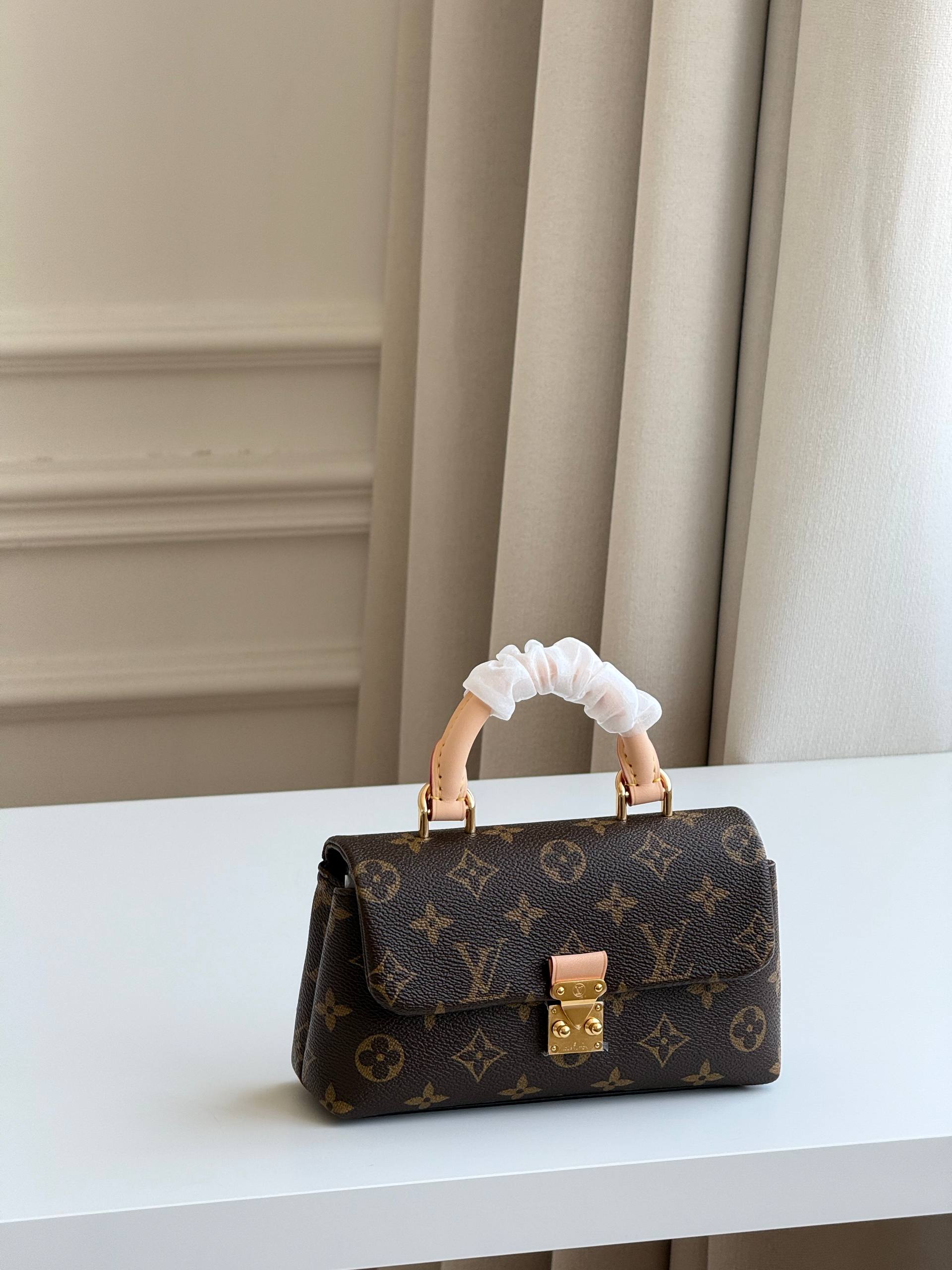 Louis Vuitton Nano Madeleine Monogram Handbag