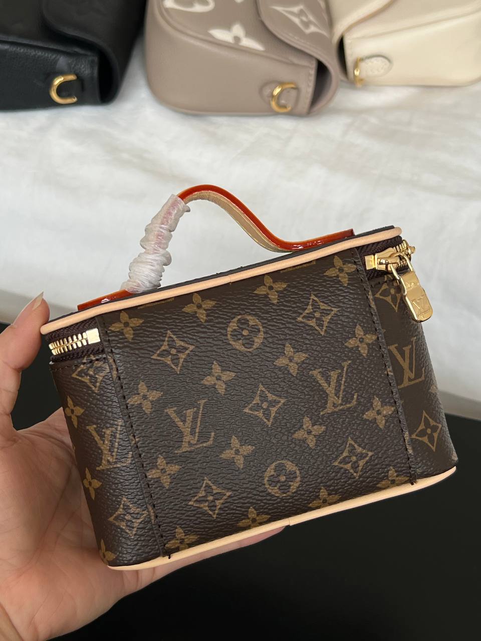 Louis Vuitton Mini Handheld Cosmetic Bag In Classic Monogram Coated Canvas