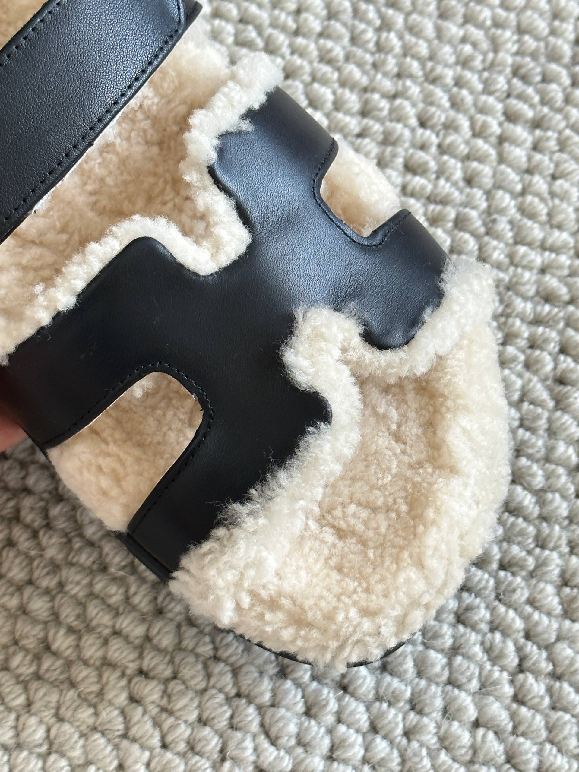 Hermès Black Calfskin & Shearling Chypre Sandals