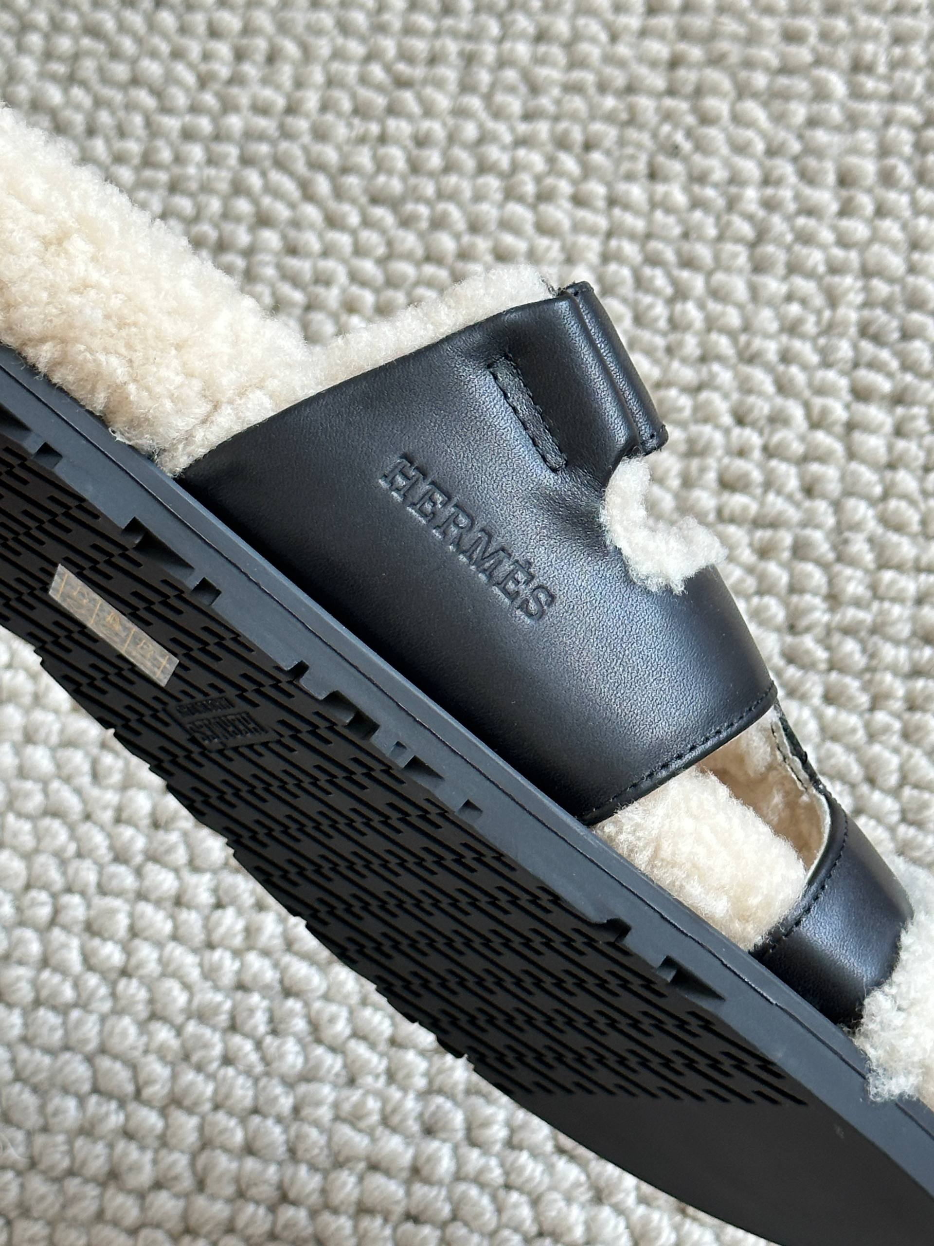 Hermès Black Calfskin & Shearling Chypre Sandals