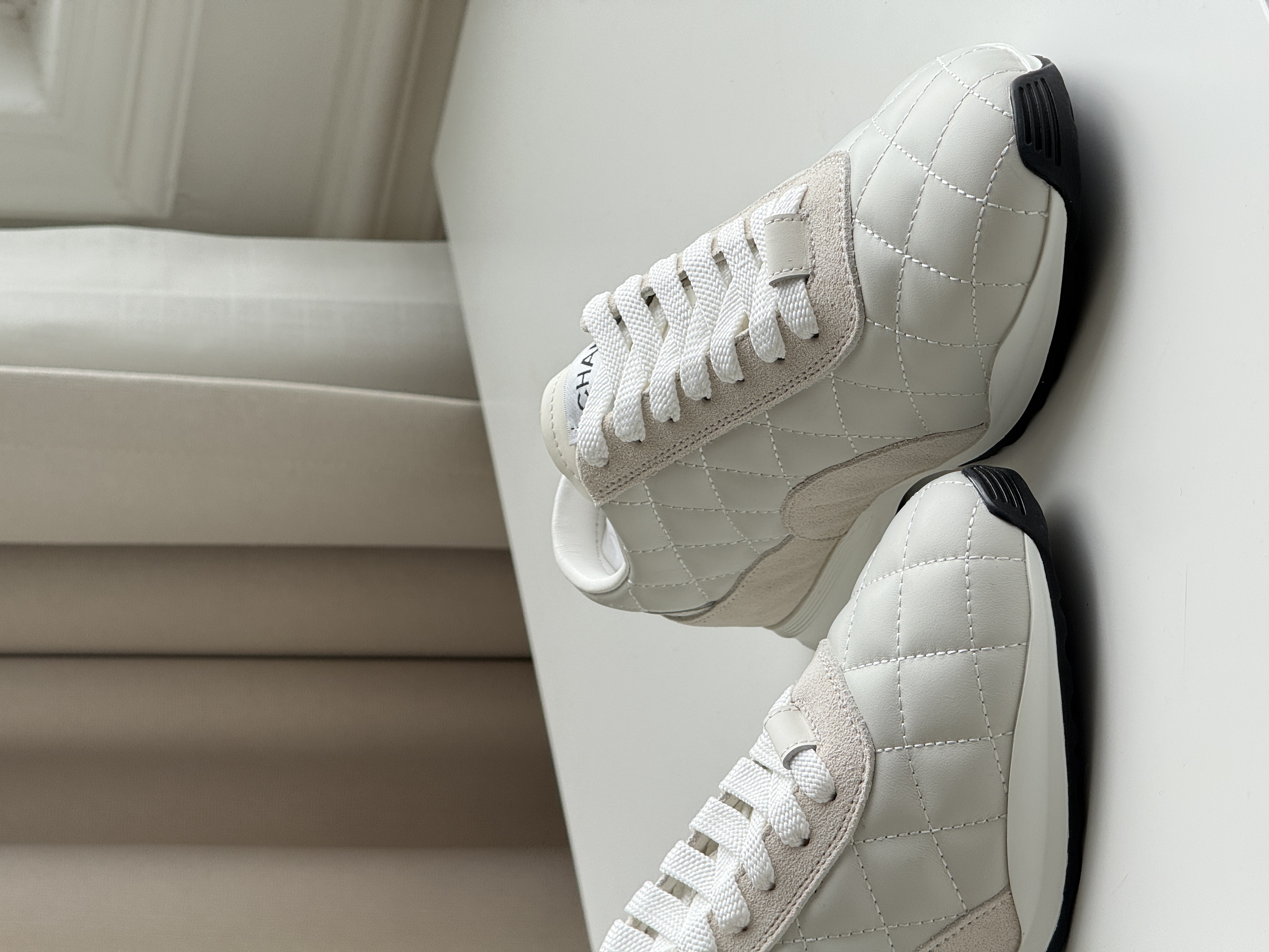 CHANEL Quilted Low-Top Sneakers