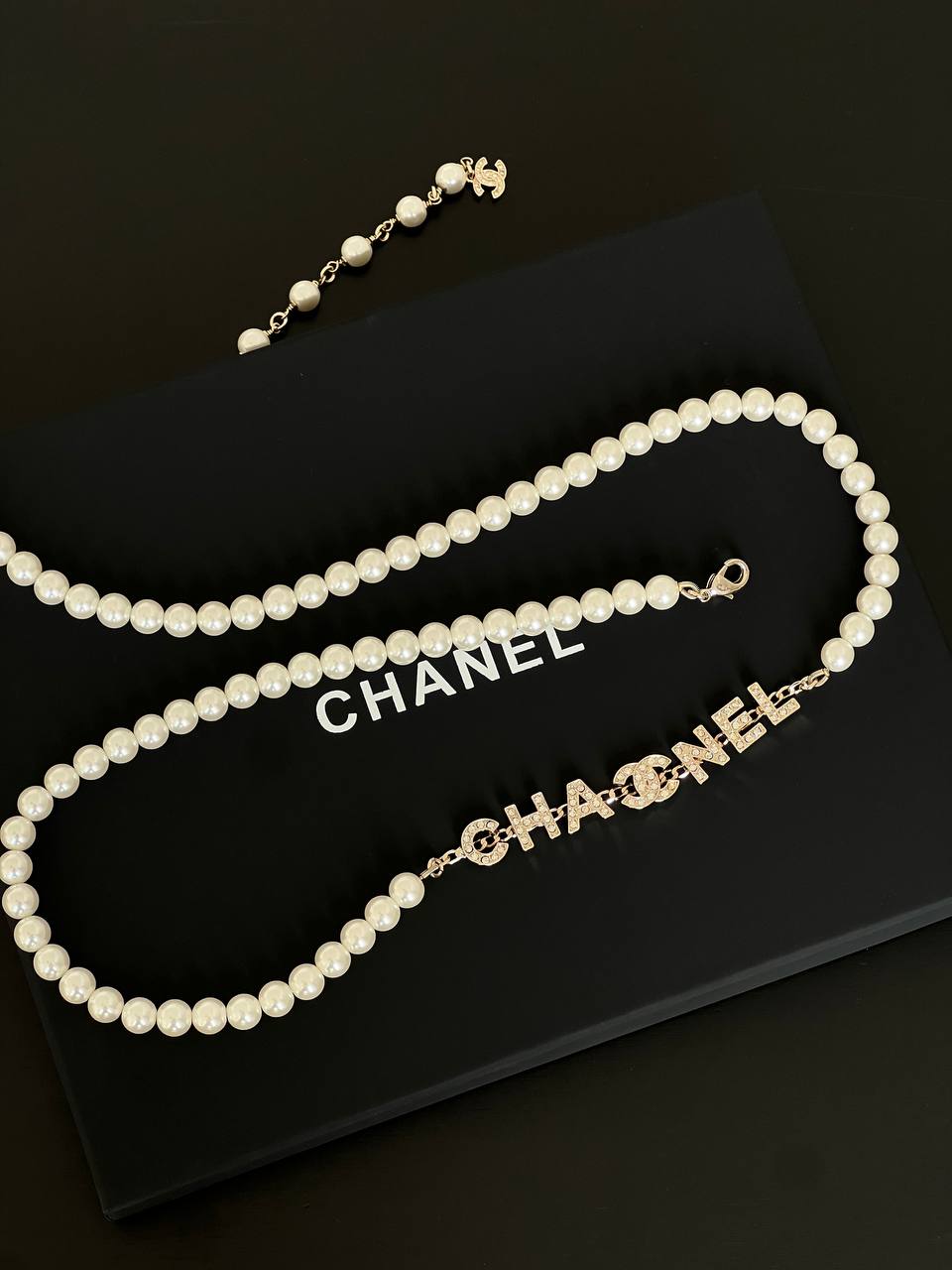 Chanel White Pearl Long Necklace With Crystal Encrusted Letter Logo