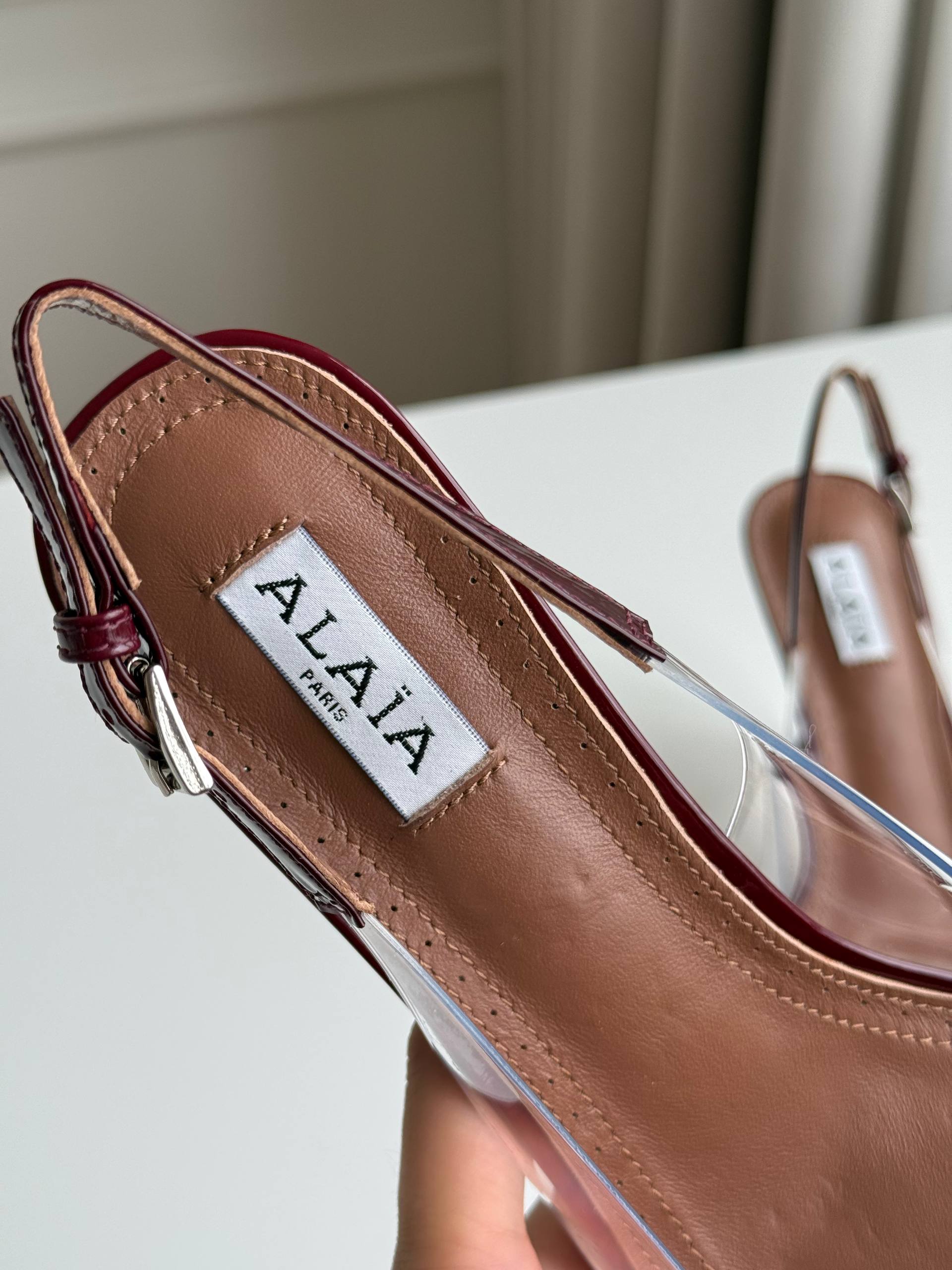 ALAÏA Le Cœur 90 Patent Leather & PVC Slingback Pumps (Burgundy)