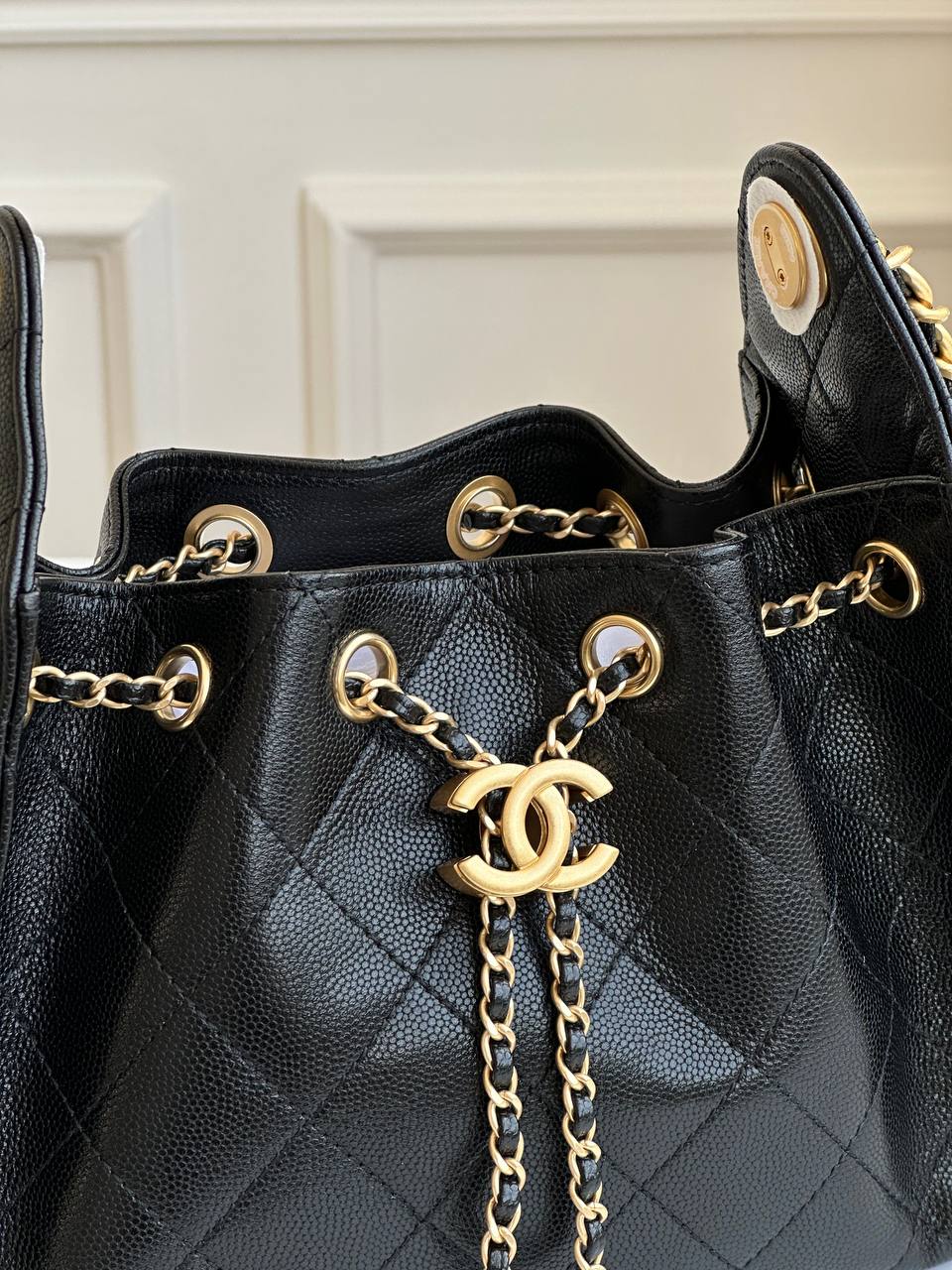 CHANEL Black Caviar Quilted Drawstring Bucket Bag with CC Logo