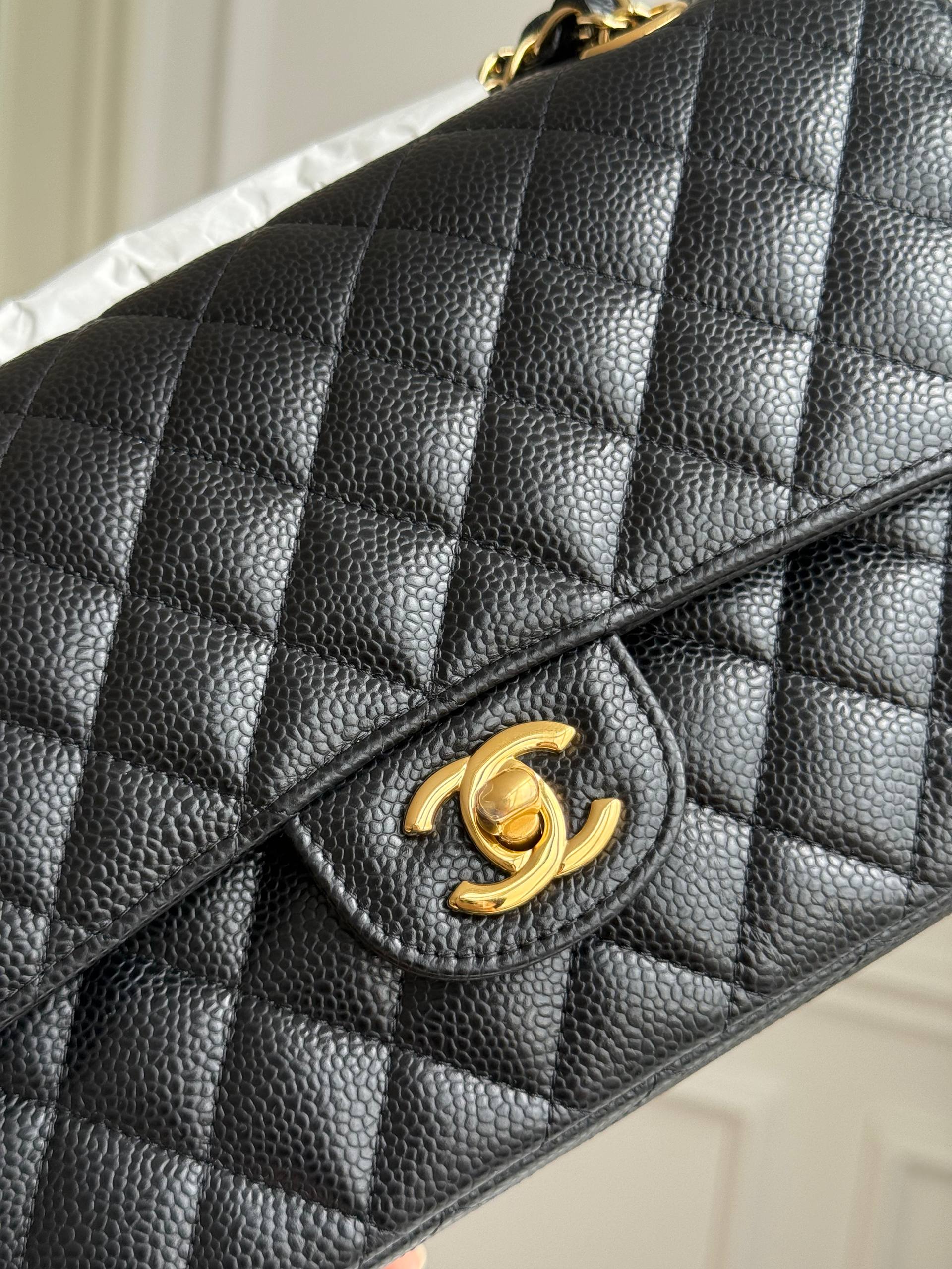 Medium-sized black and gold Chanel CF
