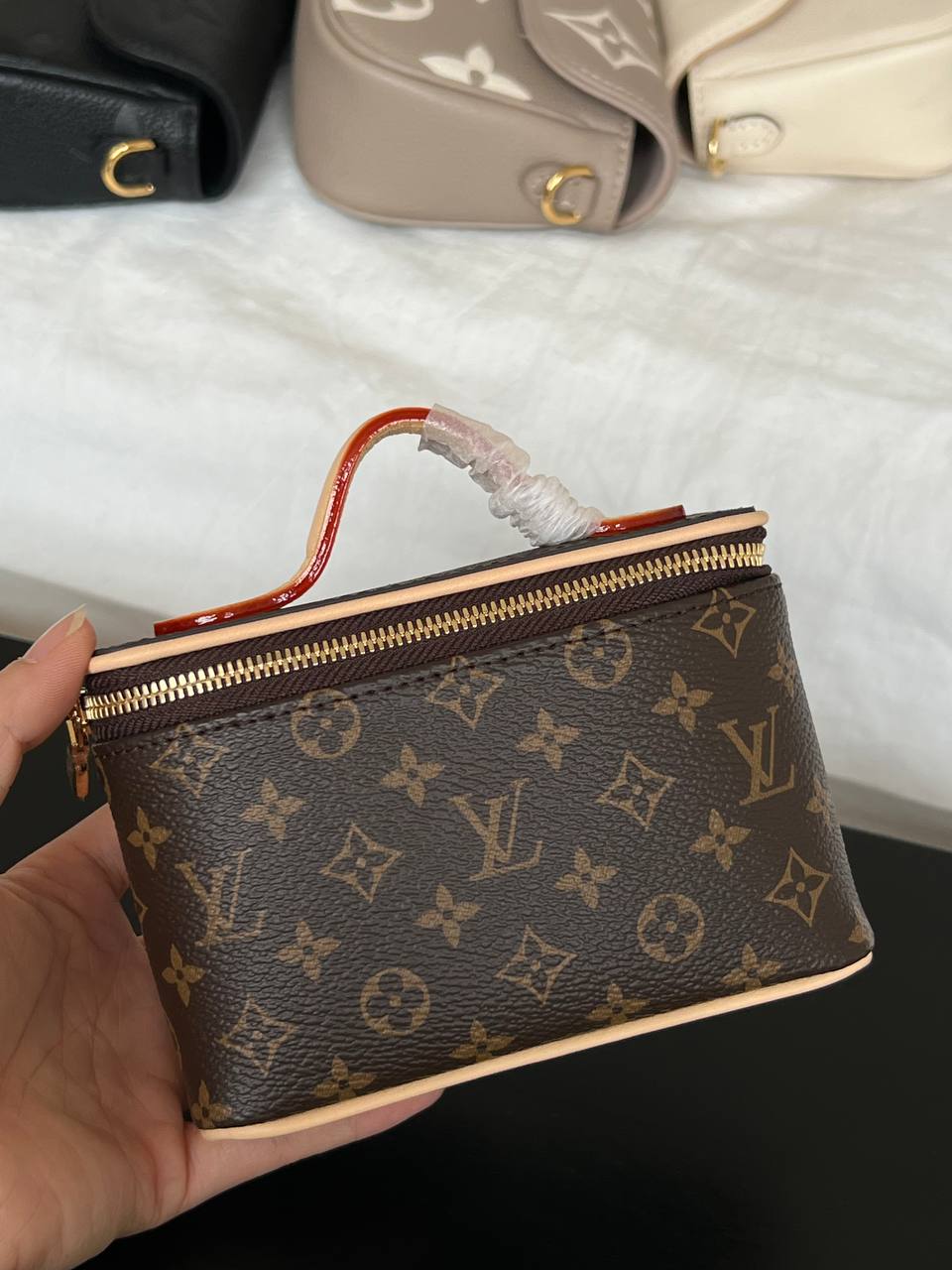 Louis Vuitton Mini Handheld Cosmetic Bag In Classic Monogram Coated Canvas