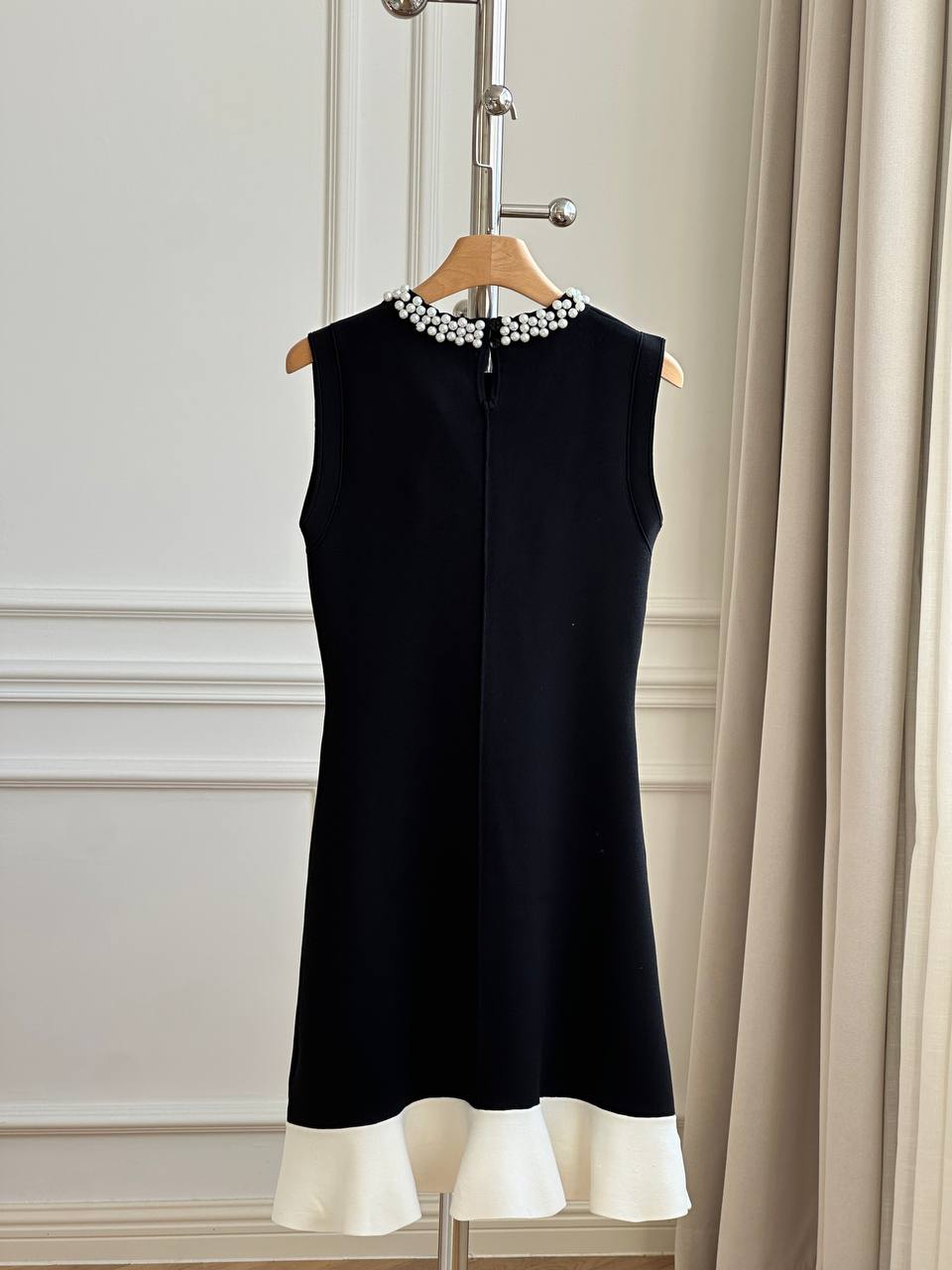 CHANEL Sleeveless Knit Dress with Pearl Neckline and Ruffled Hem