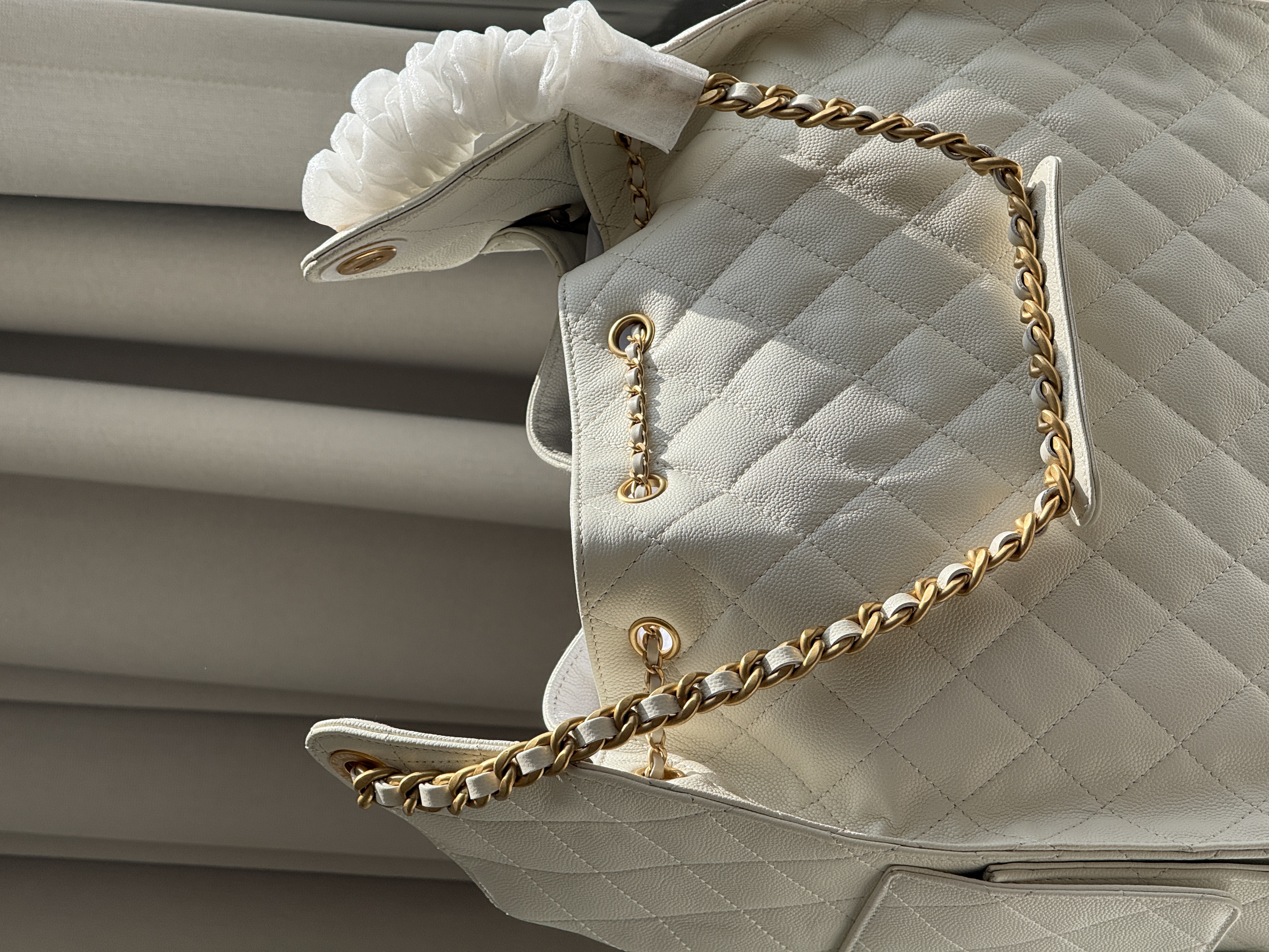 CHANEL Quilted Drawstring Bucket Bag in Milky White