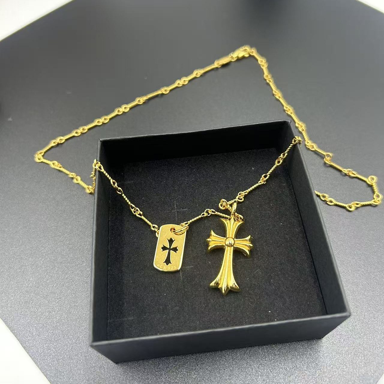 CHROME HEARTS GOLD-PLATED NECKLACE WITH TWO PENDANTS, ENCRUSTED WITH RHINESTONES, DESIGNED FOR LAYERING.
