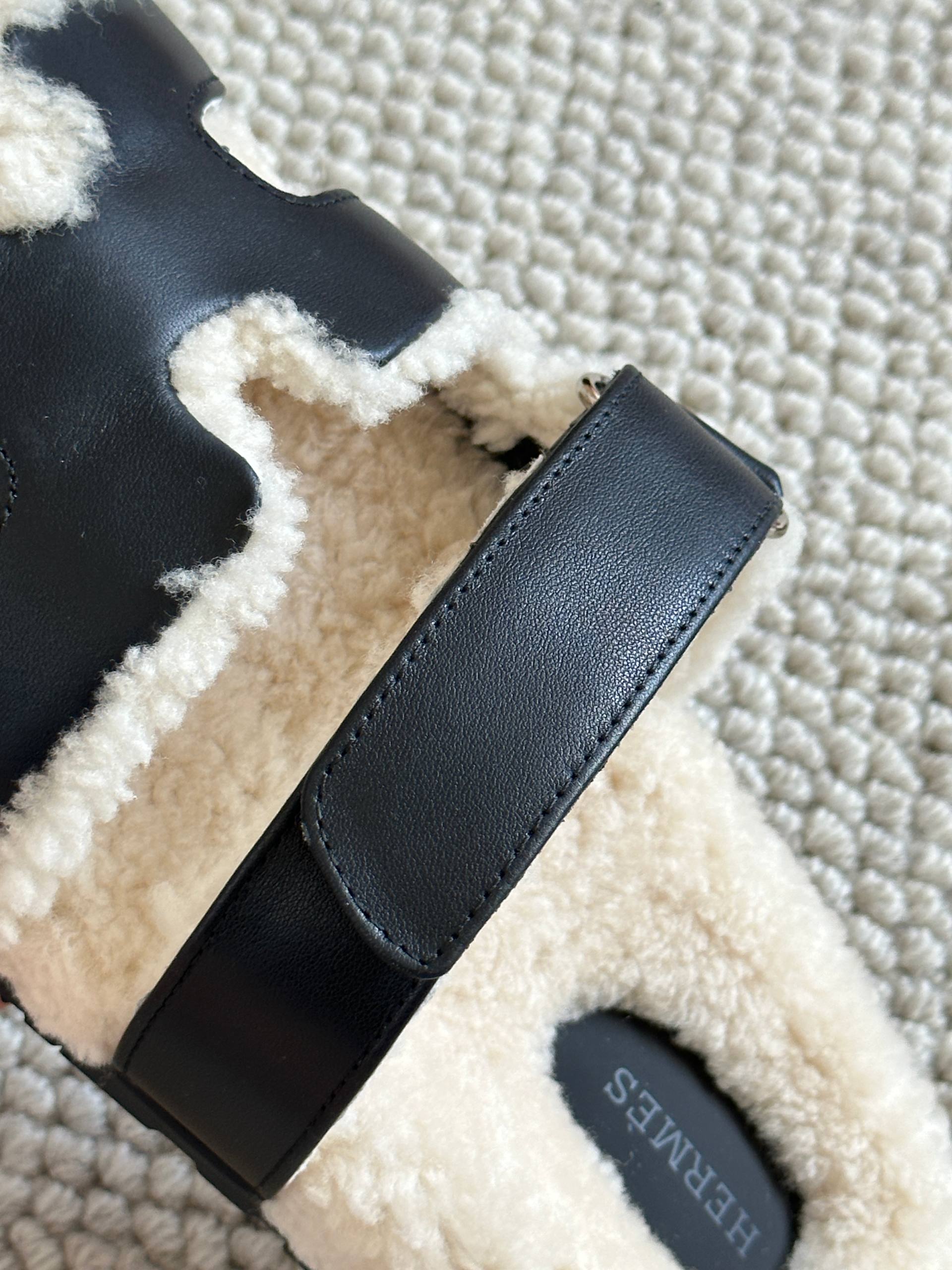 Hermès Black Calfskin & Shearling Chypre Sandals