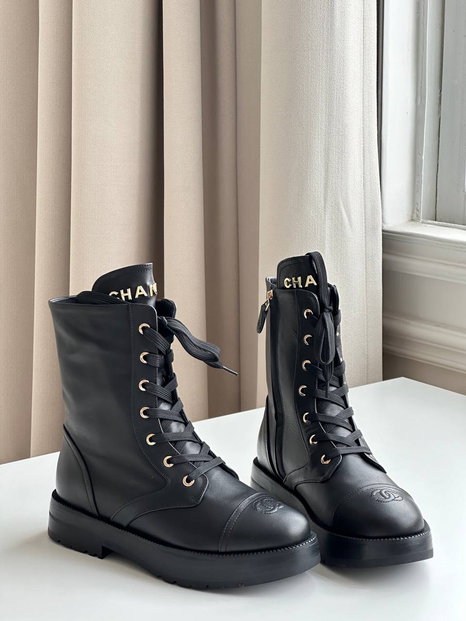 Chanel CC Embossed Leather Lace-Up Combat Boots