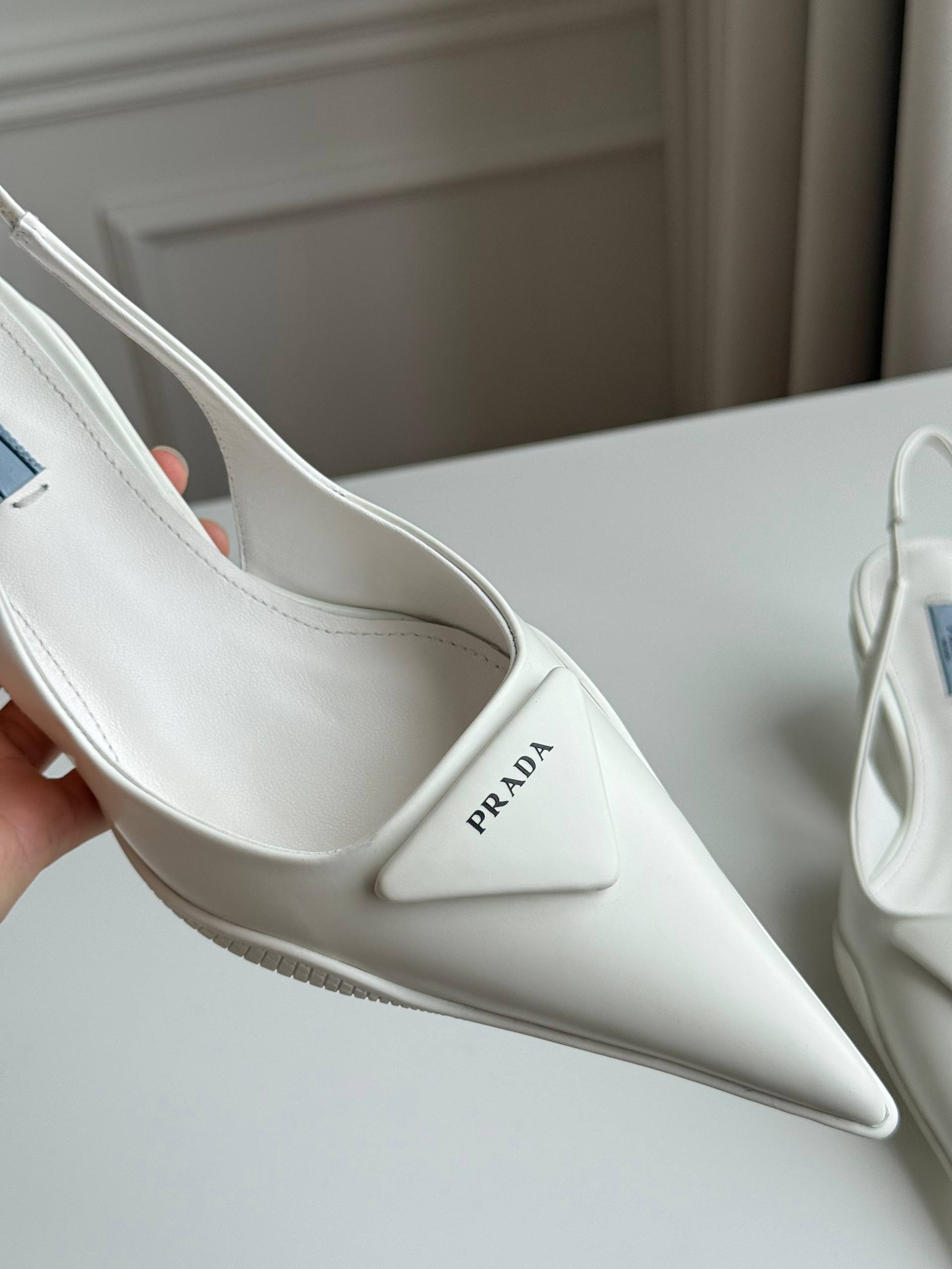 Prada Triangle Logo Slingback Pointed-Toe Kitten Heel Pumps