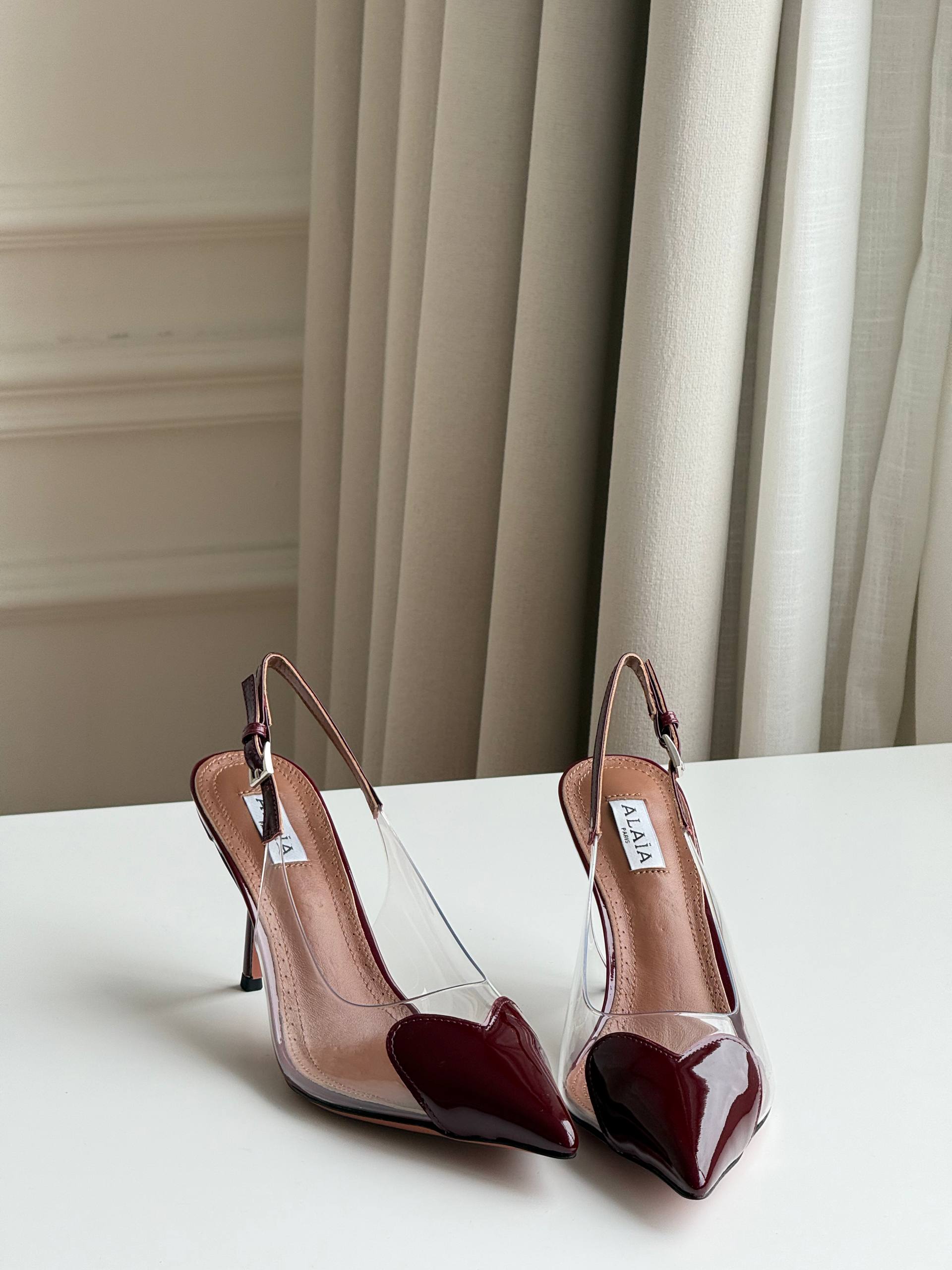 ALAÏA Le Cœur 90 Patent Leather & PVC Slingback Pumps (Burgundy)