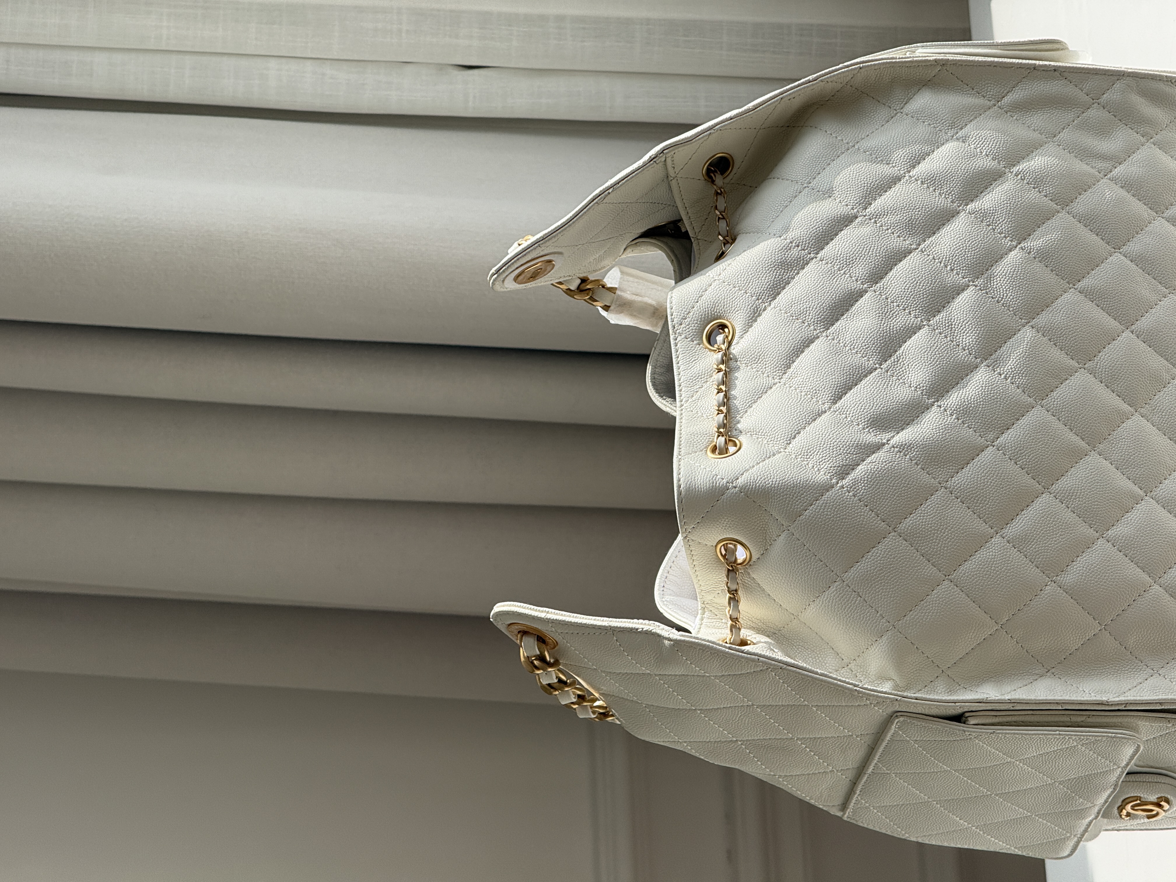 CHANEL Quilted Drawstring Bucket Bag in Milky White