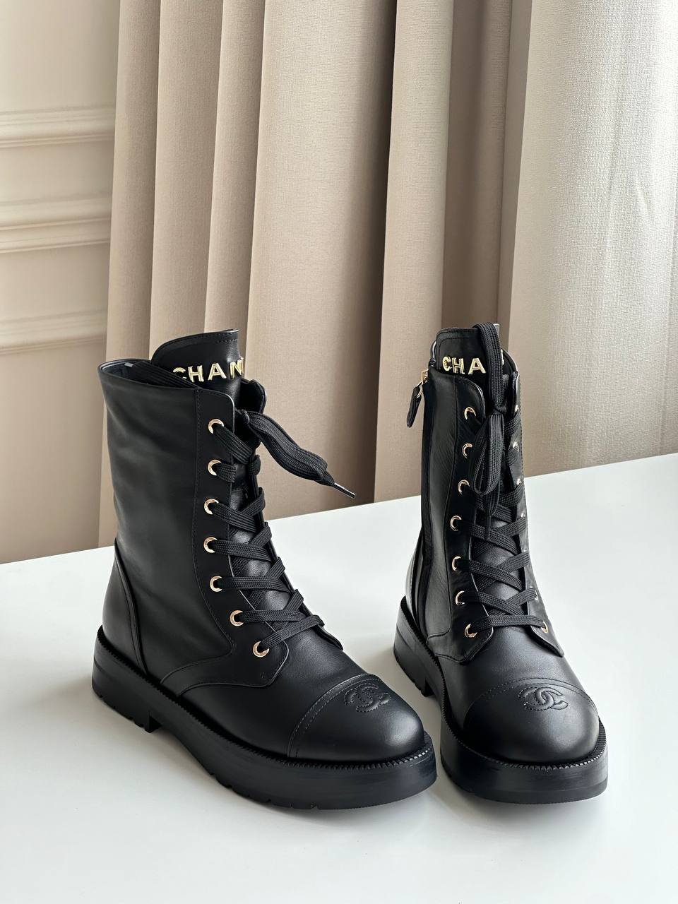 Chanel CC Embossed Leather Lace-Up Combat Boots