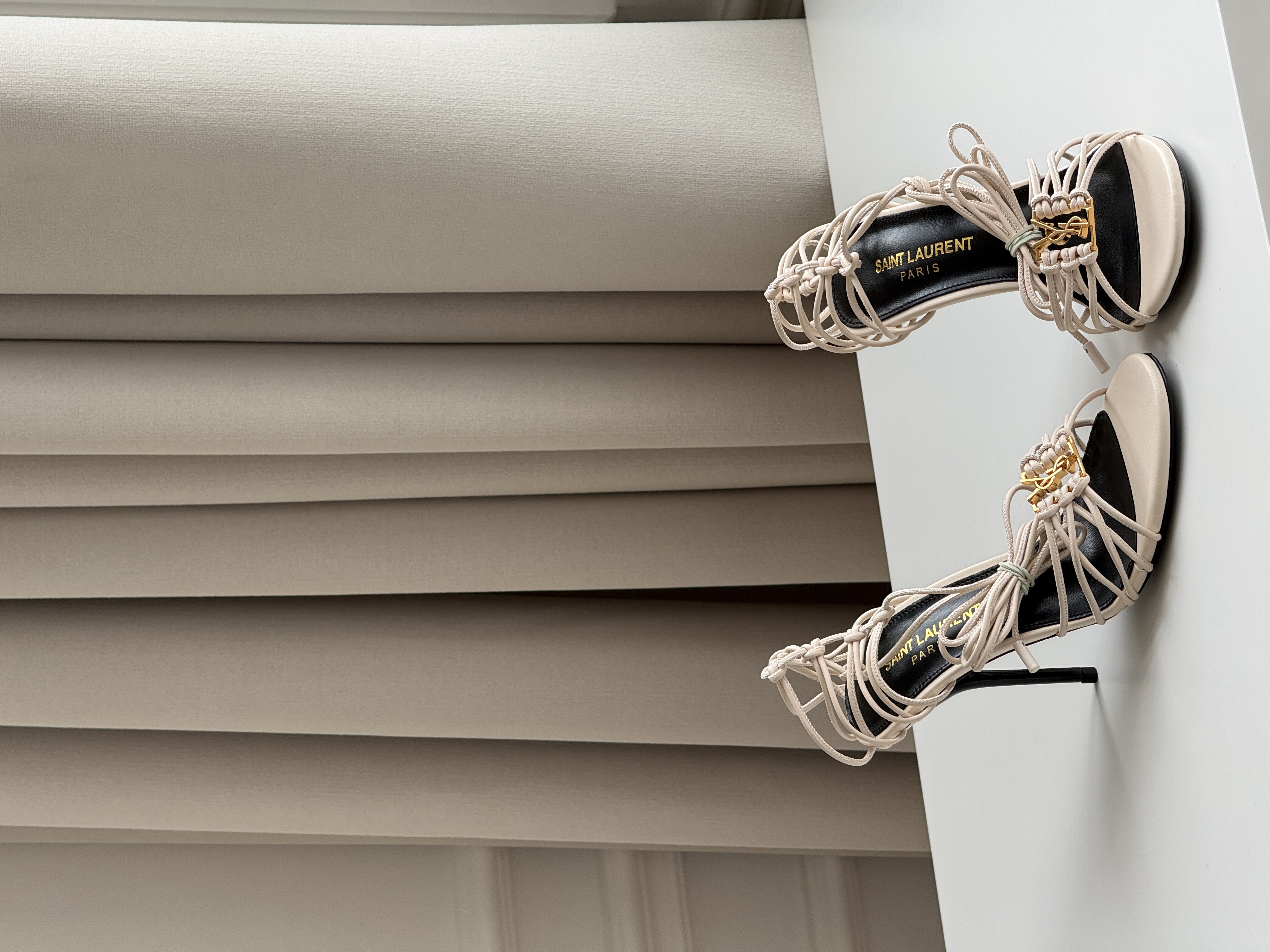 Saint Laurent Off-White Knotted Strappy Stiletto Heel Sandals with YSL Logo
