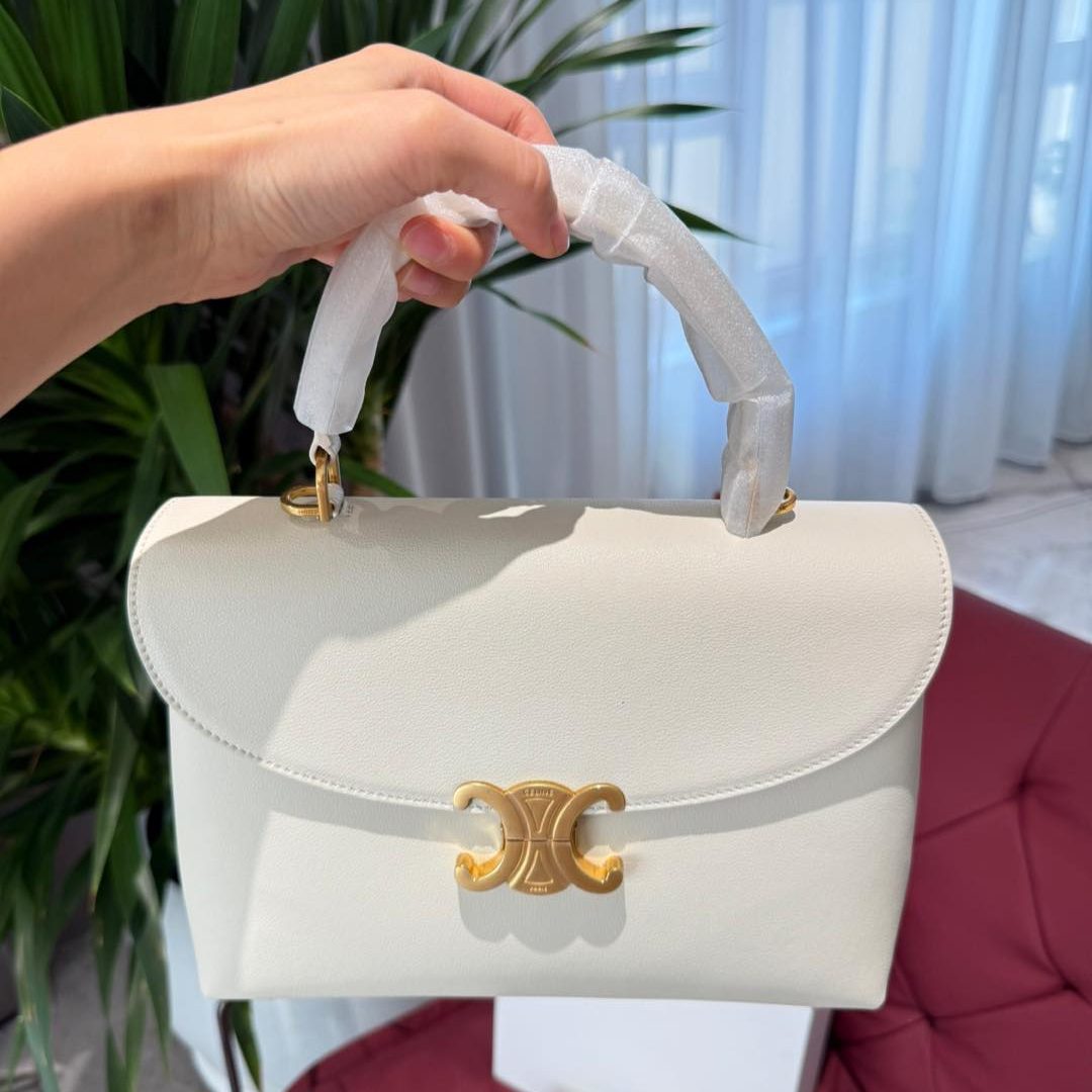 MEDIUM BUCKET IN TRIOMPHE CANVAS ANDCALFSKIN