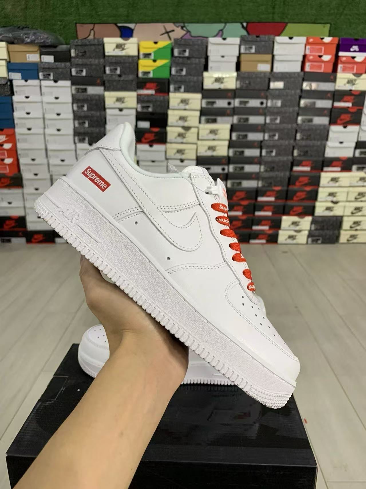 Supreme red and white sneakers