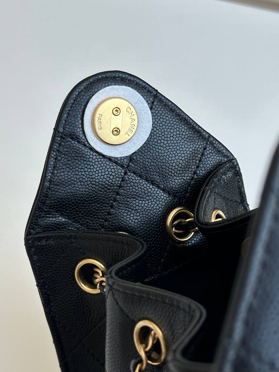 CHANEL Black Caviar Quilted Drawstring Bucket Bag with CC Logo