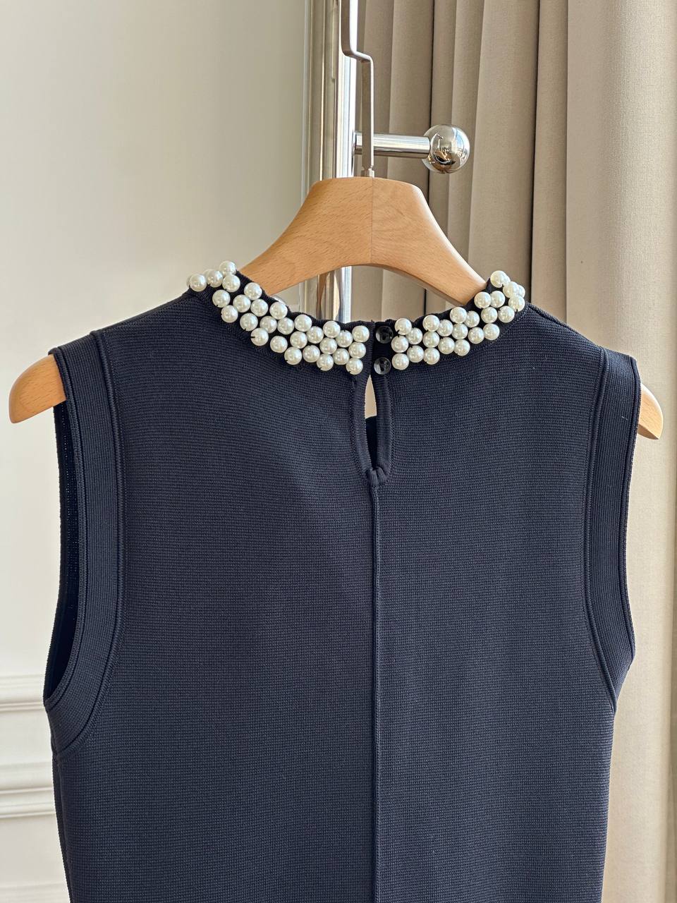 CHANEL Sleeveless Knit Dress with Pearl Neckline and Ruffled Hem