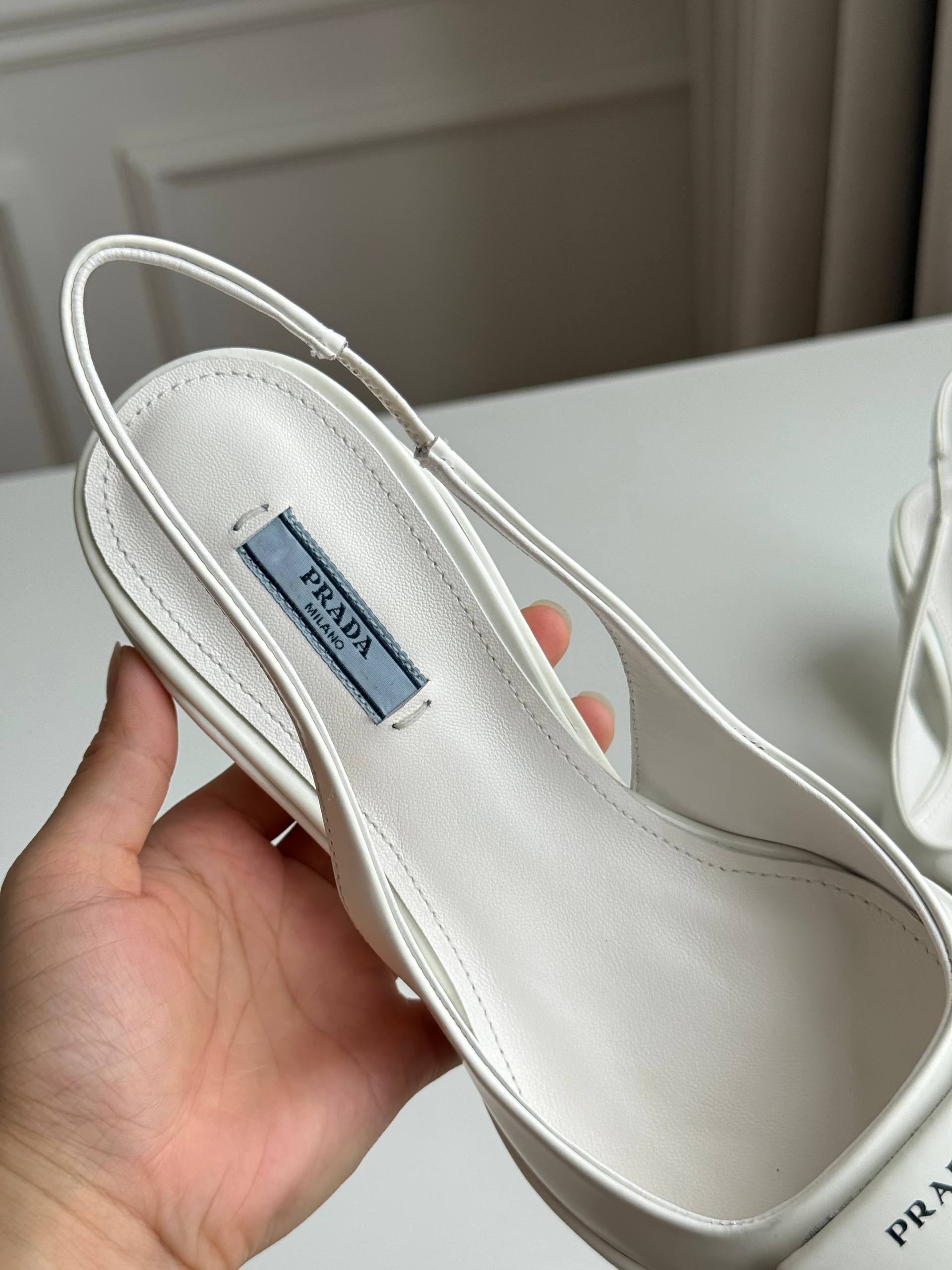 Prada Triangle Logo Slingback Pointed-Toe Kitten Heel Pumps