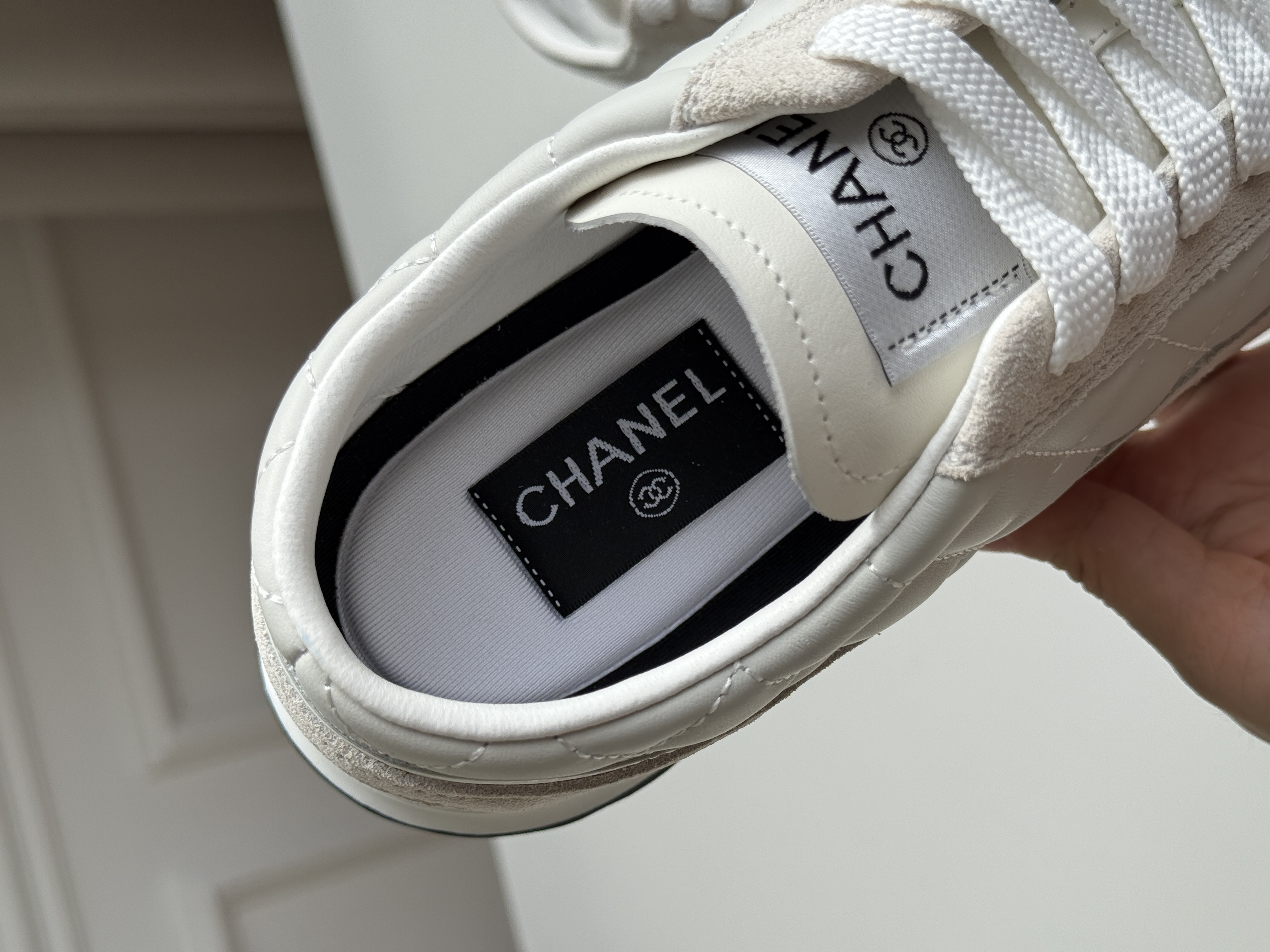 CHANEL Quilted Low-Top Sneakers