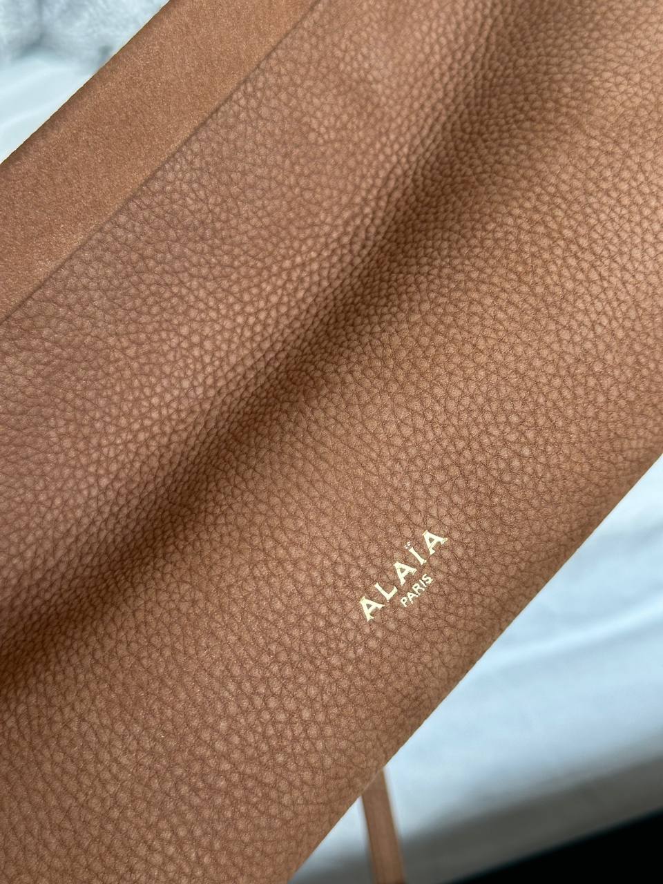 ALAÏA Le Click Medium East-West Pebbled Calfskin Shoulder Bag