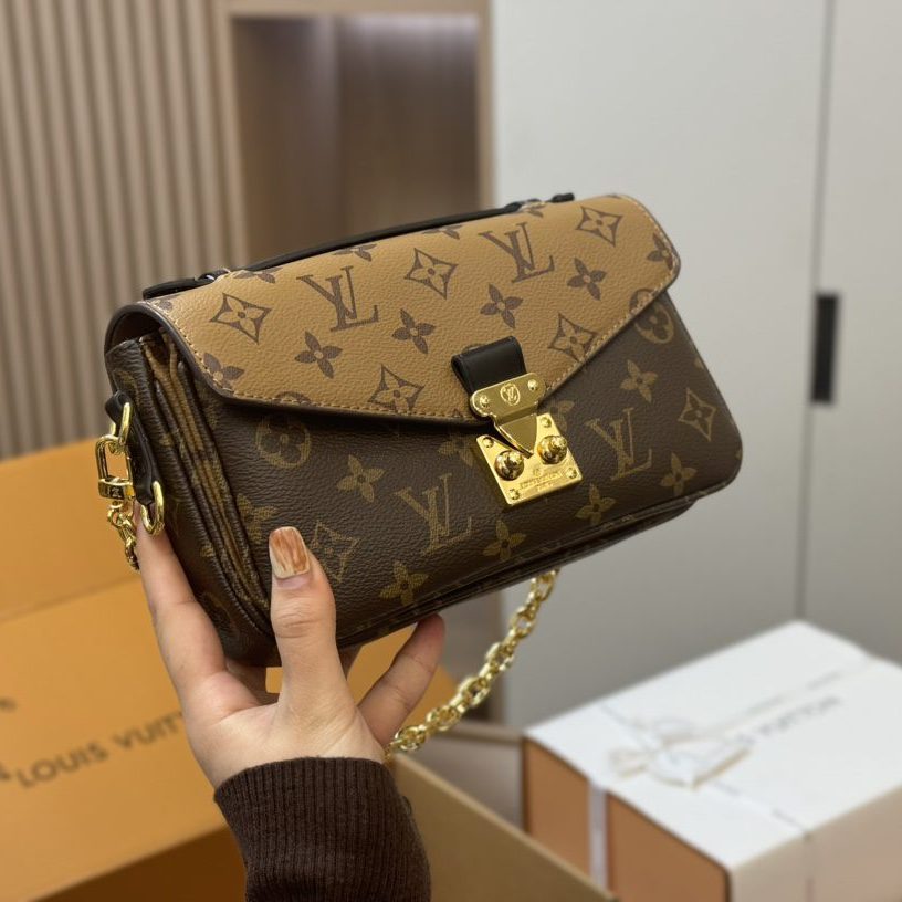 POCHETTE METIS EAST WEST MONOGRAM 21X6X13CM