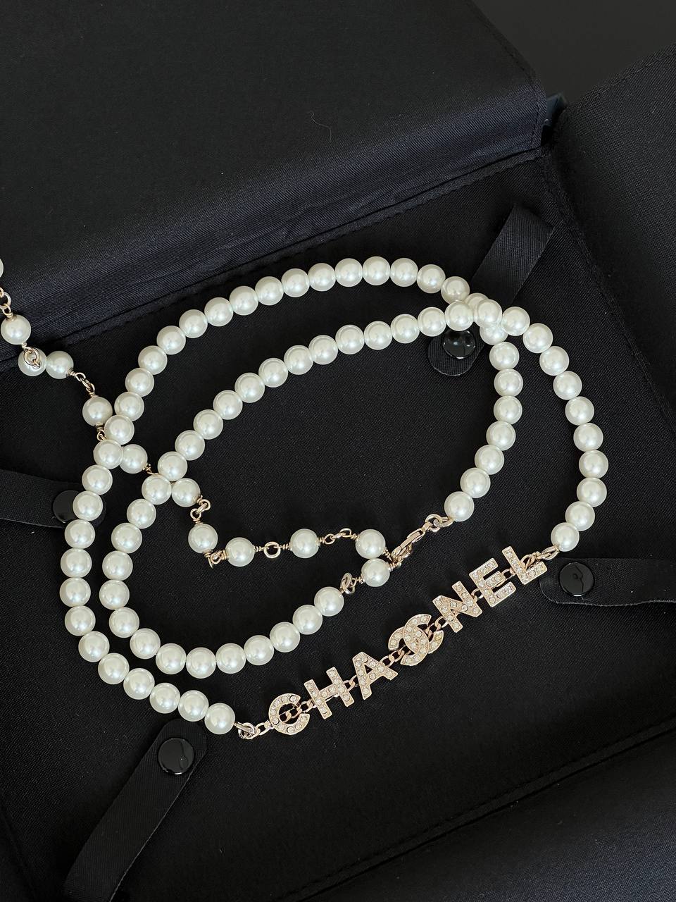 Chanel White Pearl Long Necklace With Crystal Encrusted Letter Logo