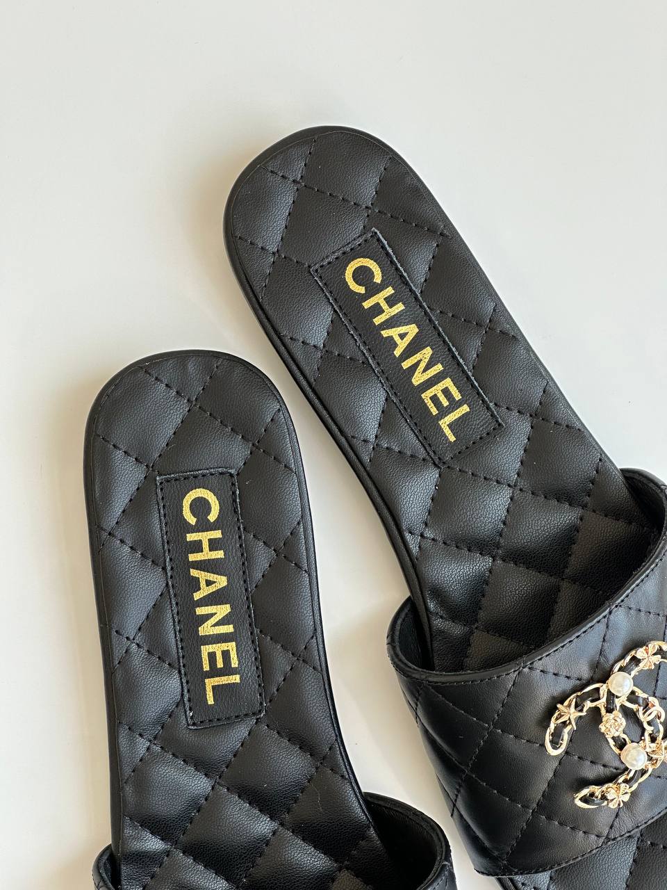 Chanel Black Quilted Lambskin Pearl Chain CC Logo Flat Slide Sandals