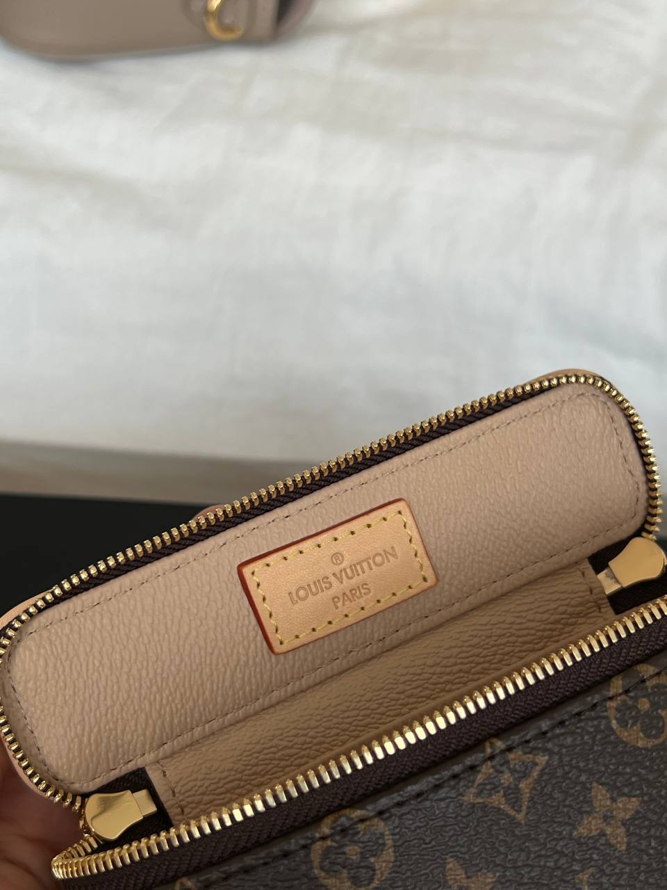 Louis Vuitton Mini Handheld Cosmetic Bag In Classic Monogram Coated Canvas