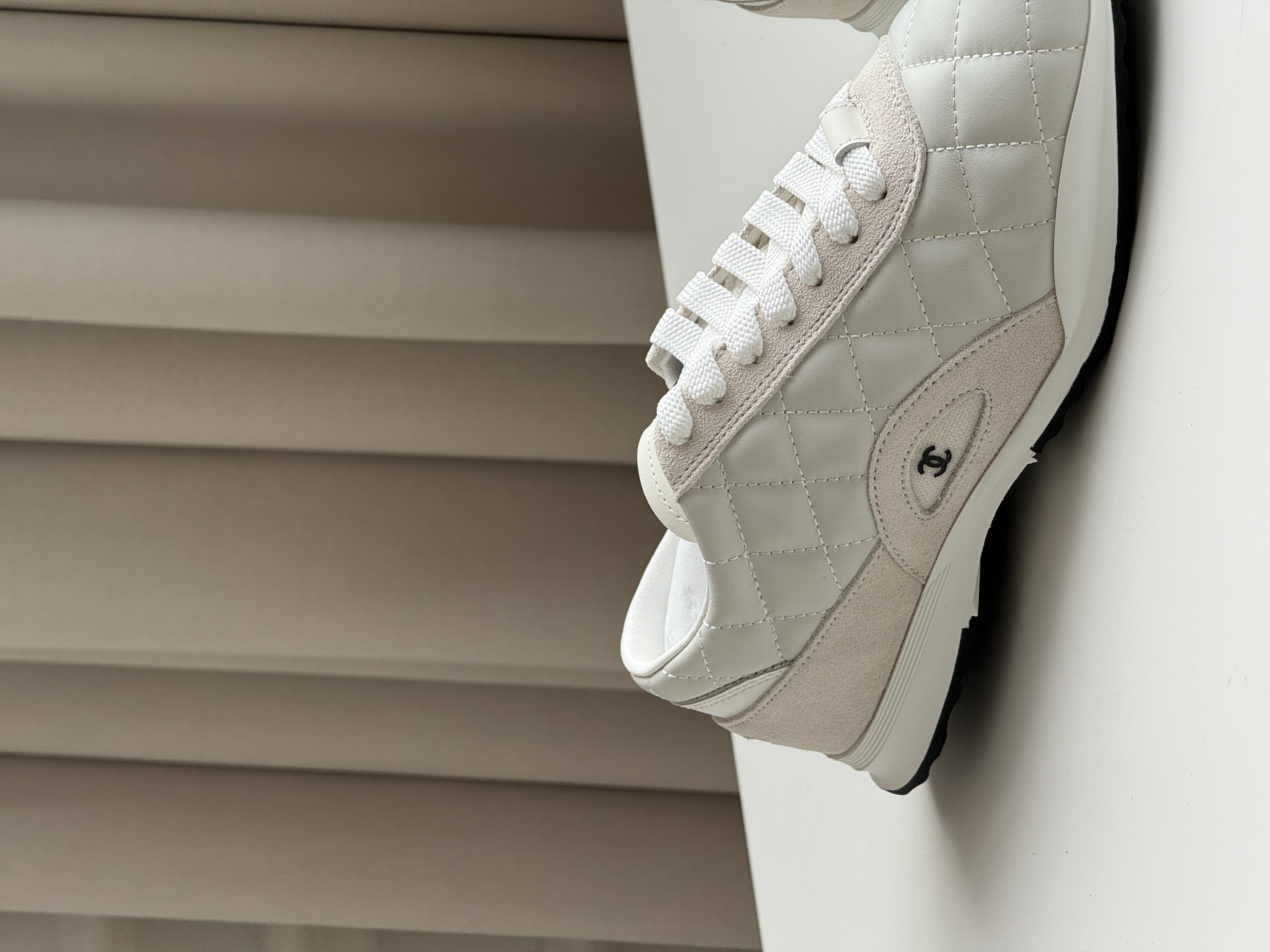 CHANEL Quilted Low-Top Sneakers