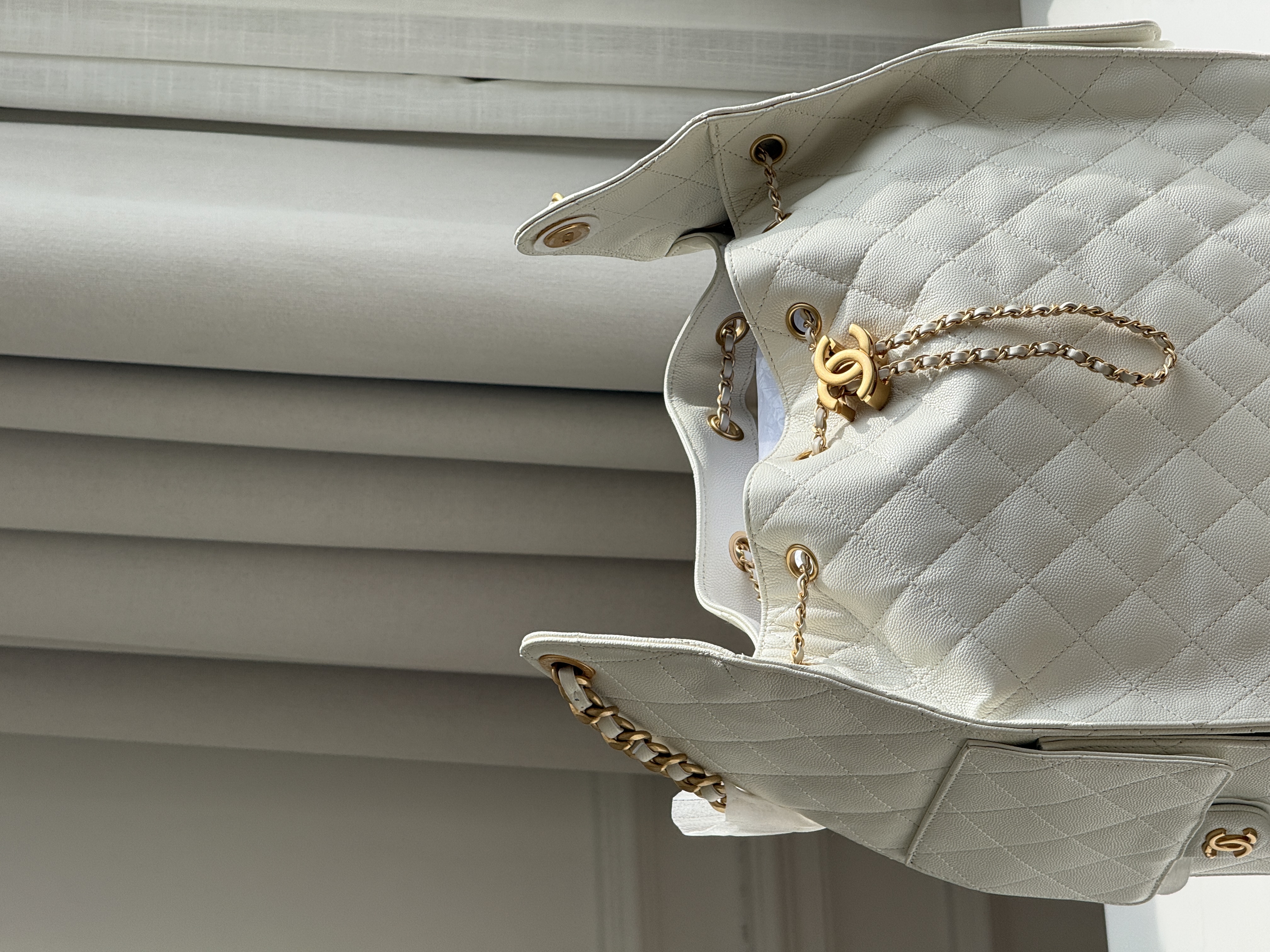 CHANEL Quilted Drawstring Bucket Bag in Milky White