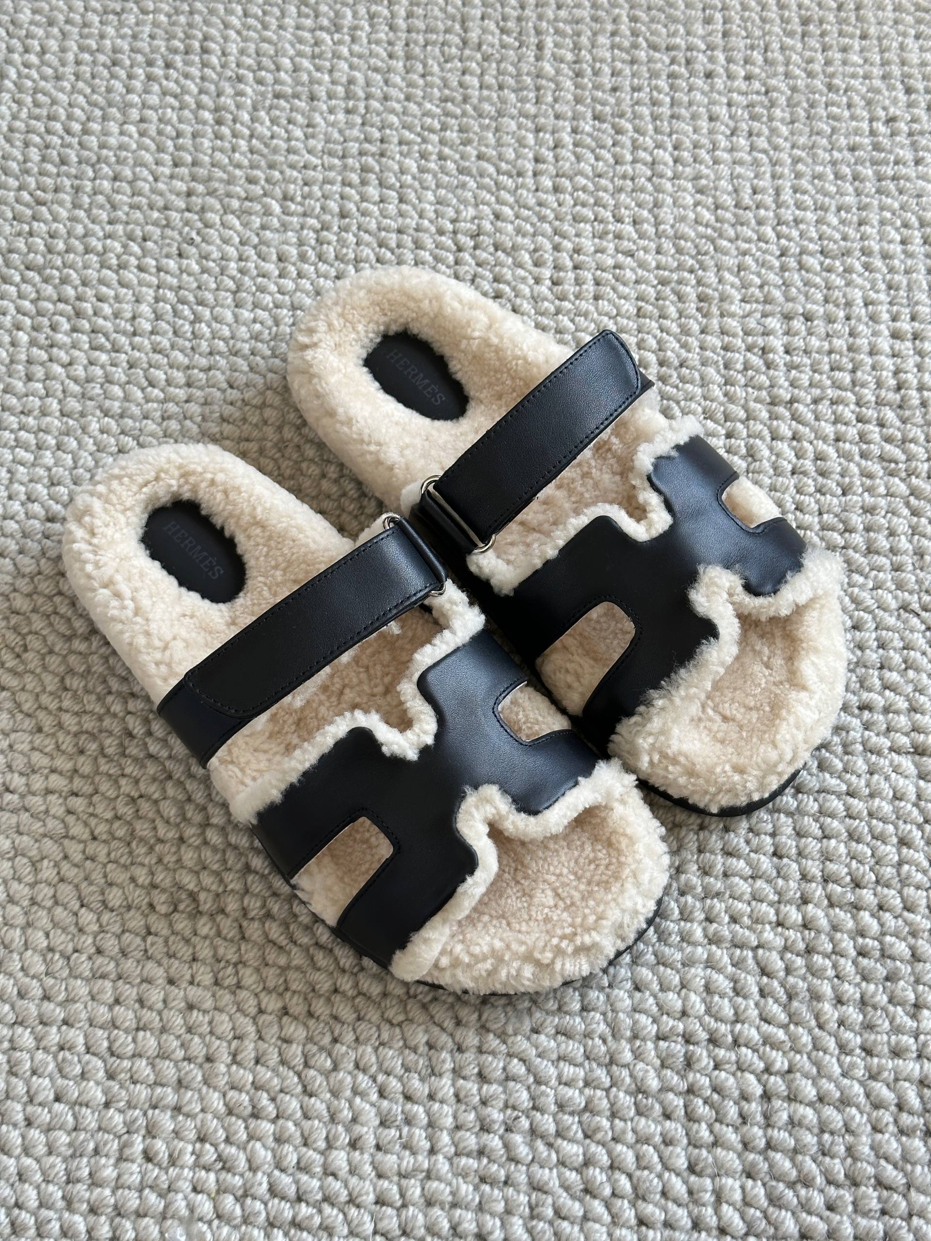 Hermès Black Calfskin & Shearling Chypre Sandals