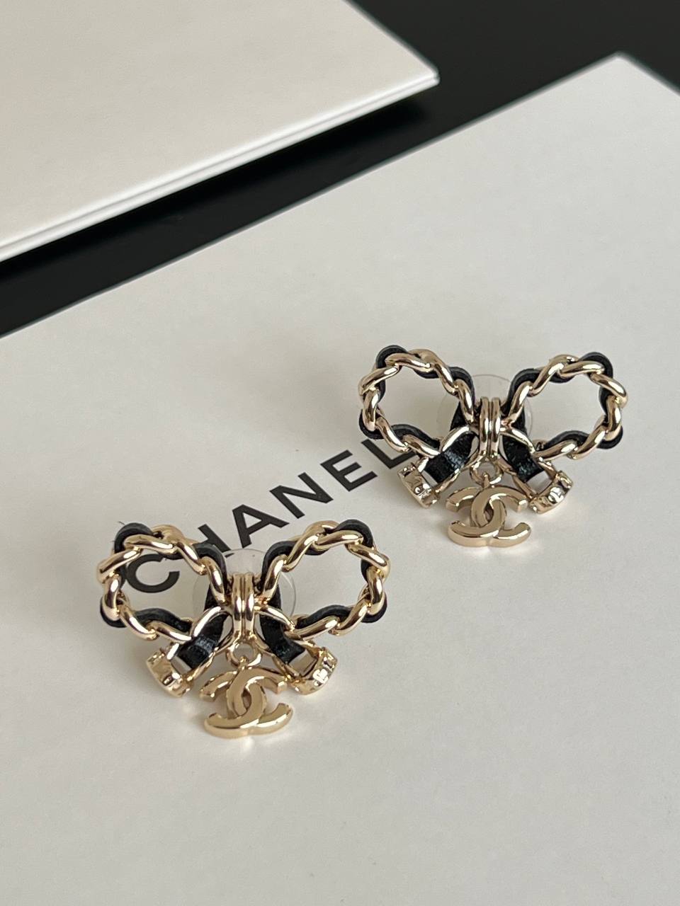 Chanel Leather Interwoven Chain Bow CC Charm Stud Earrings