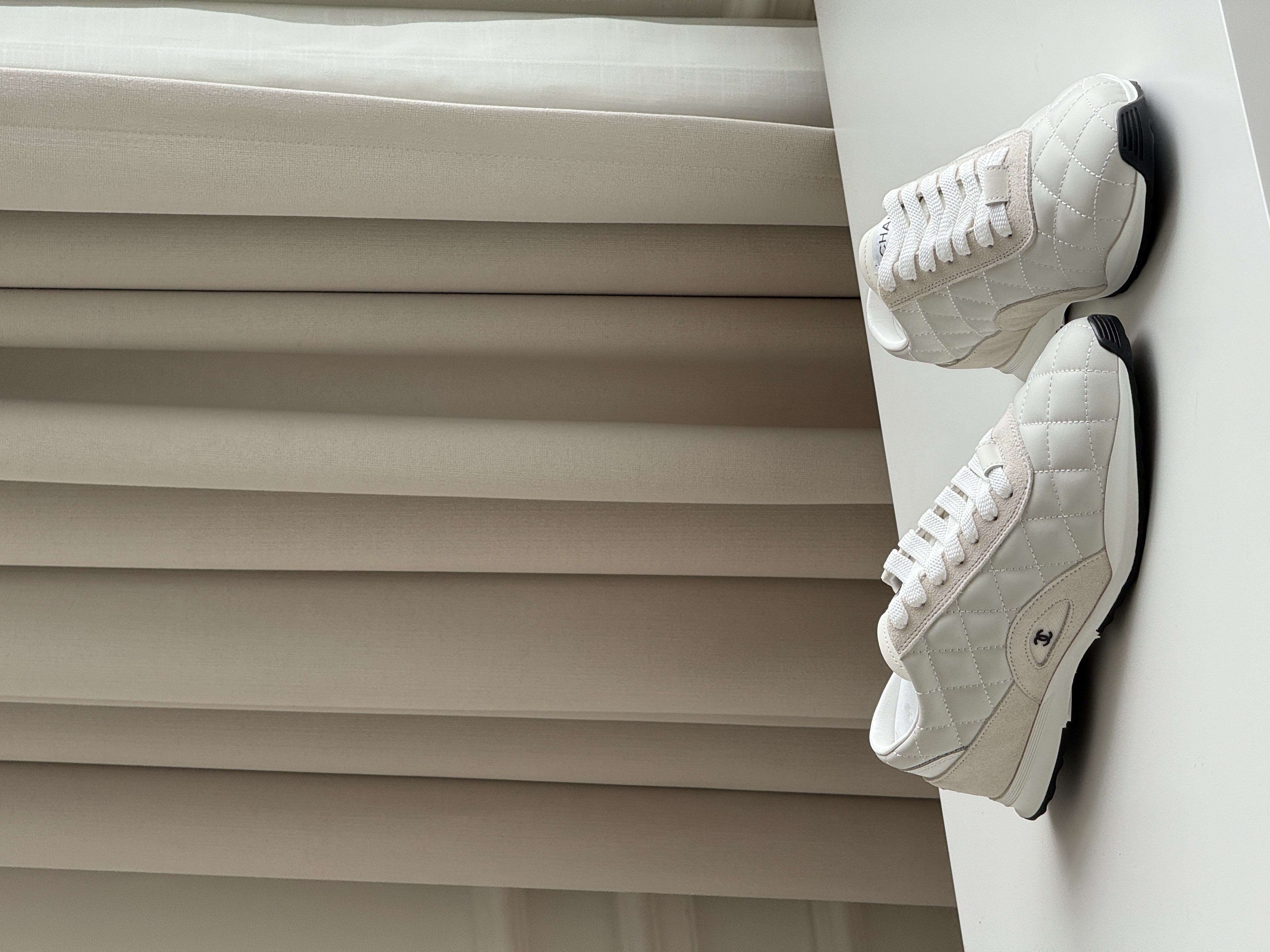 CHANEL Quilted Low-Top Sneakers