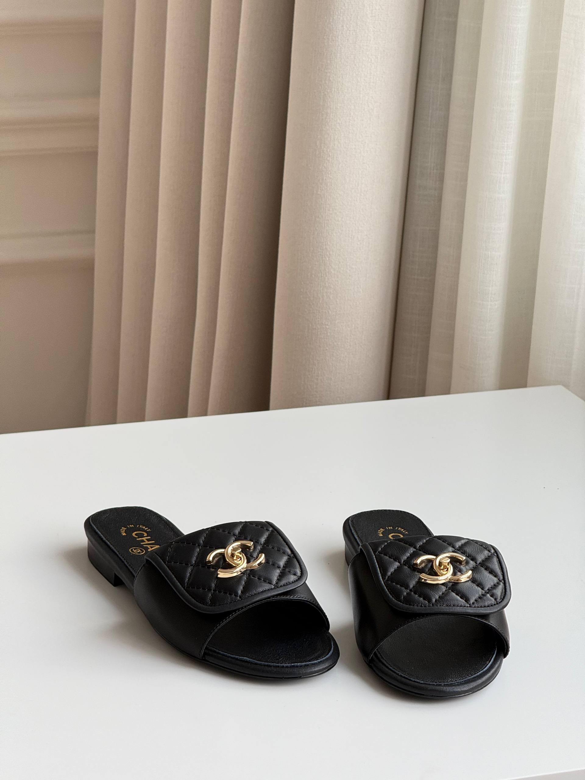 CHANEL QUILTED CC TURNLOCK FLAT MULES