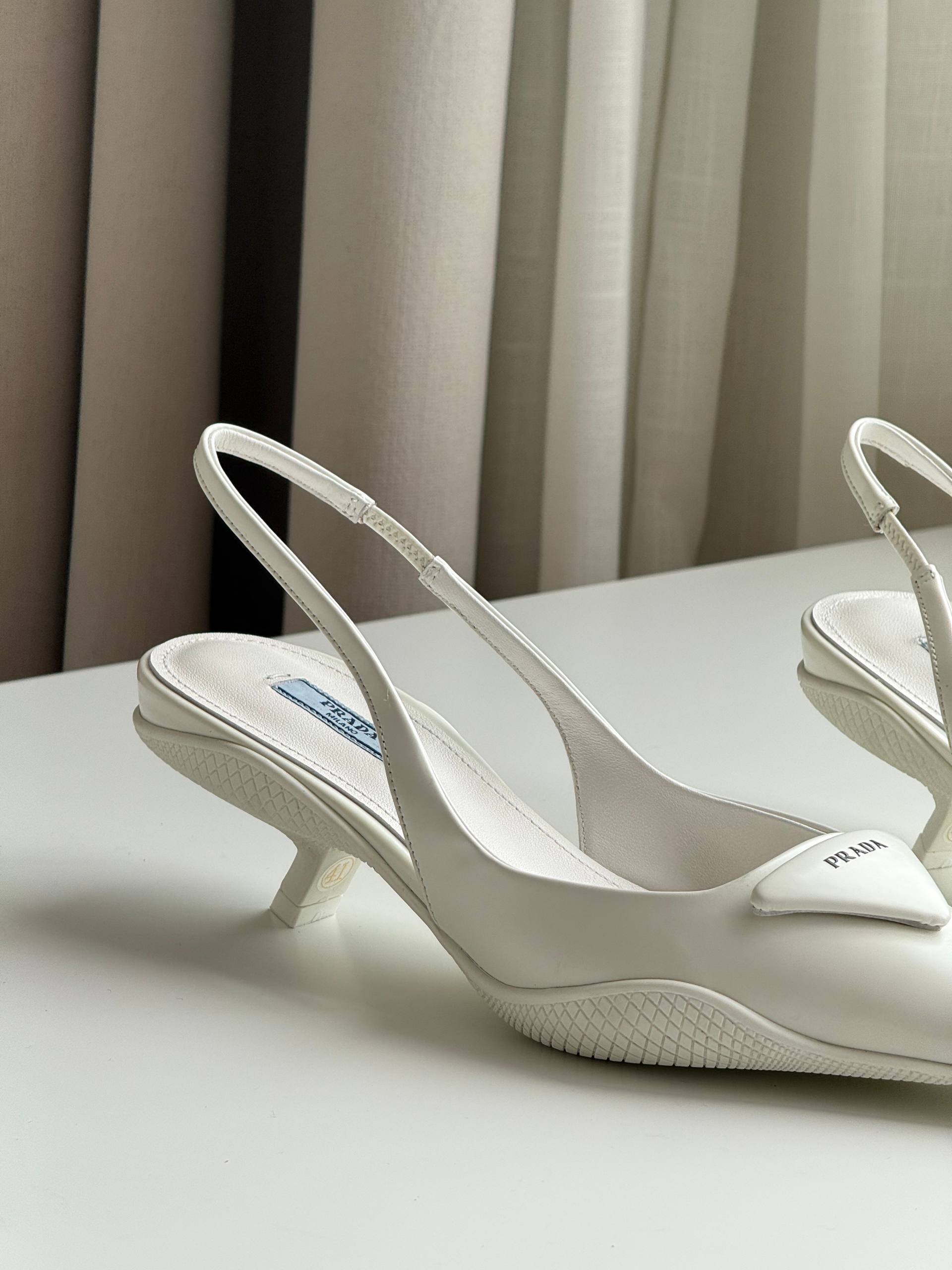 Prada Triangle Logo Slingback Pointed-Toe Kitten Heel Pumps