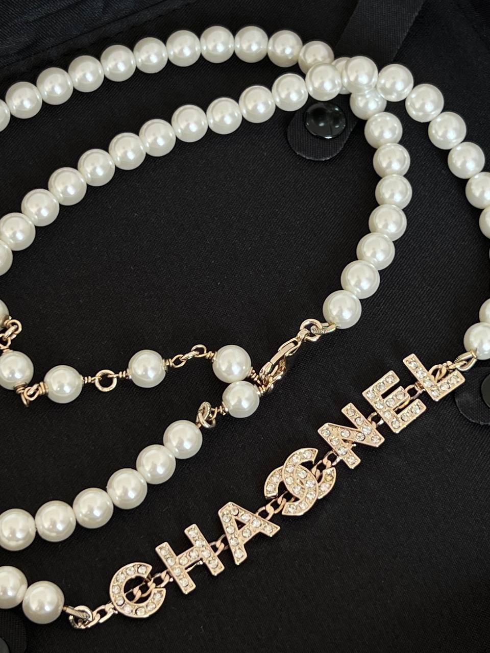 Chanel White Pearl Long Necklace With Crystal Encrusted Letter Logo