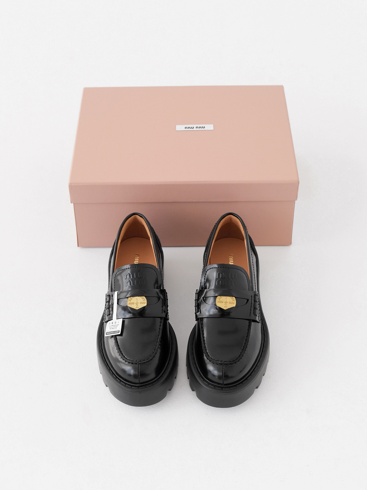 Miumiu thick-soled coin loafers