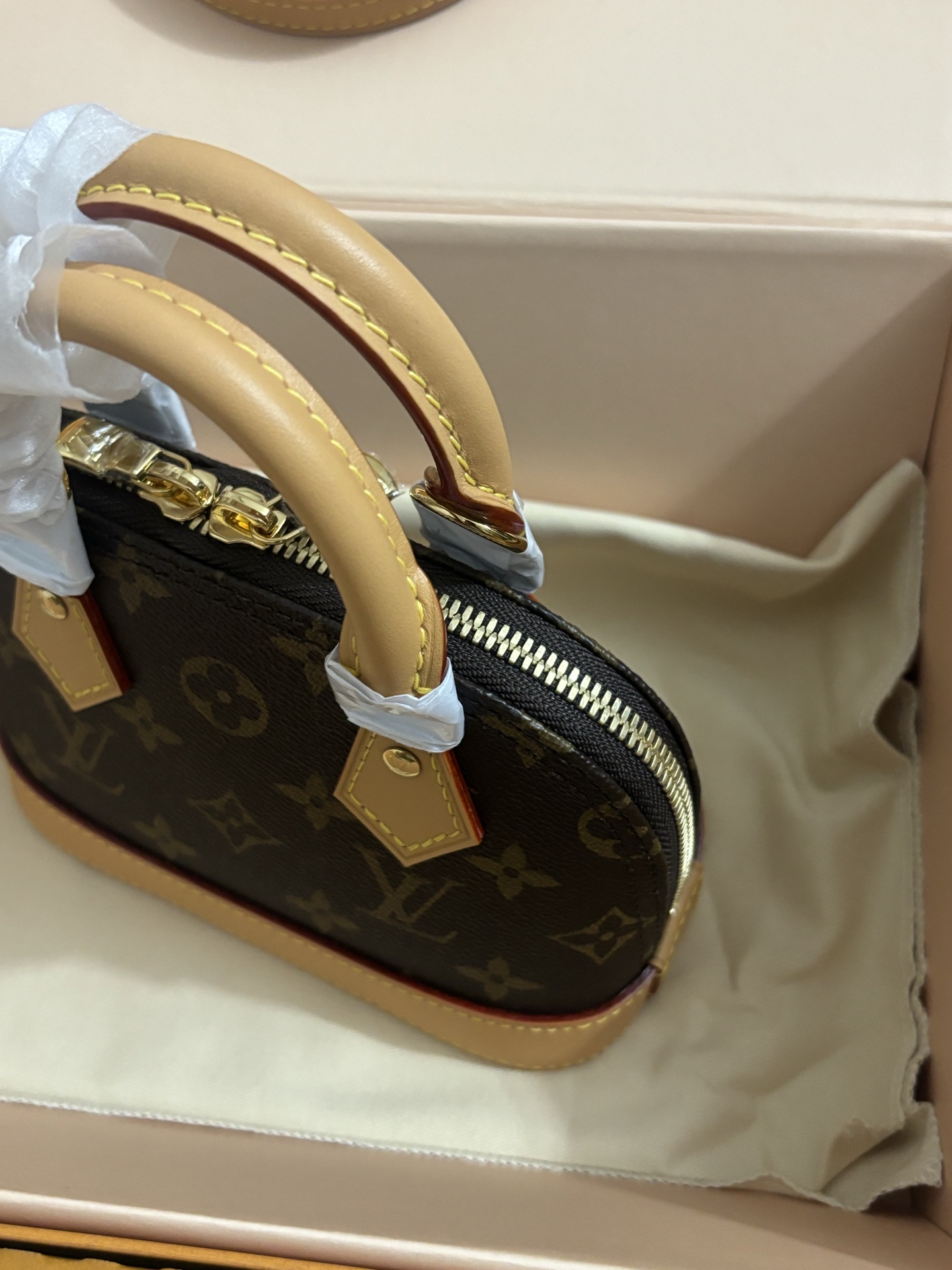 Louis Vuitton NANO ALMA Handbag