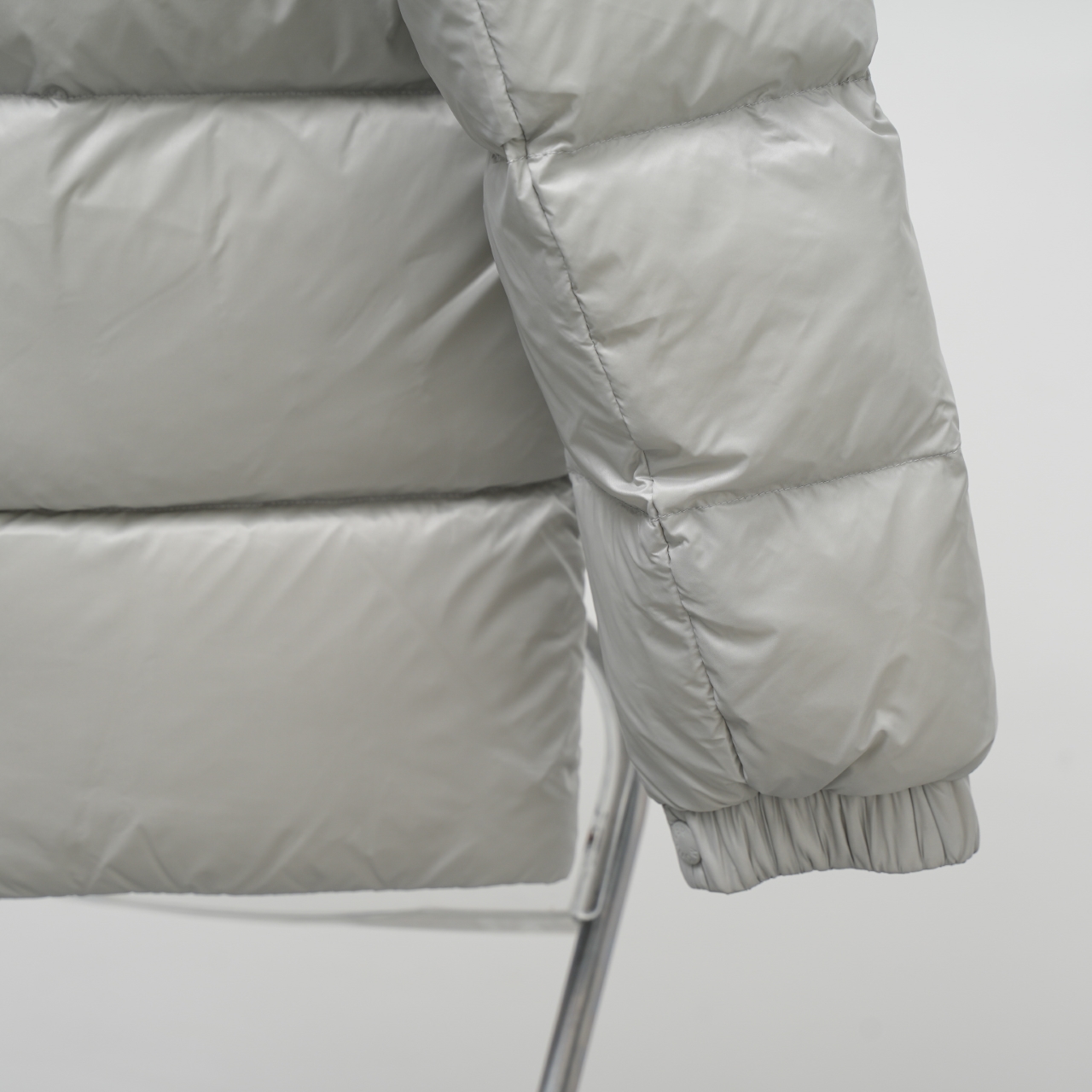 Moncler stand-collar down jacket with a large chest logo