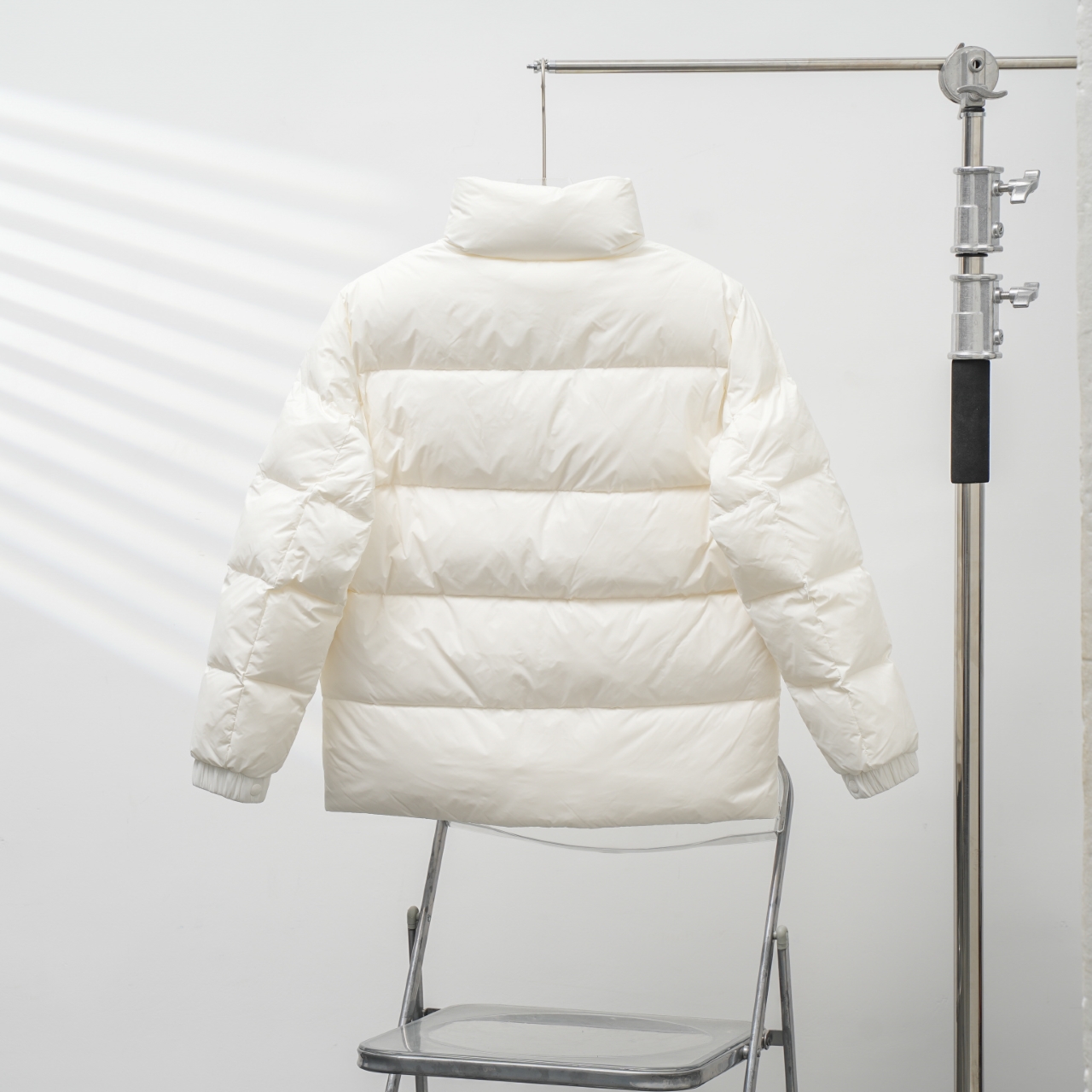 Moncler stand-collar down jacket with a large chest logo