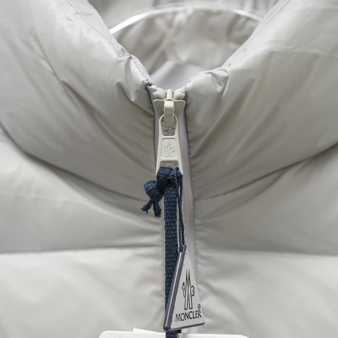 Moncler stand-collar down jacket with a large chest logo